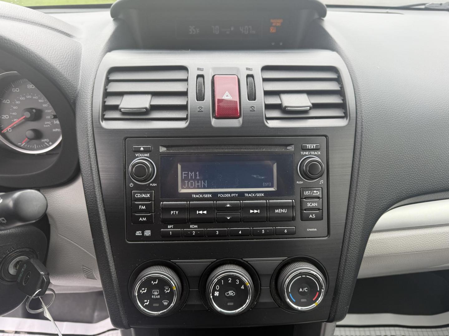 2014 Red /Gray Subaru Forester 2.5i (JF2SJAAC6EH) with an 2.5L H4 DOHC 16V engine, Automatic transmission, located at 11115 Chardon Rd. , Chardon, OH, 44024, (440) 214-9705, 41.580246, -81.241943 - Photo#16