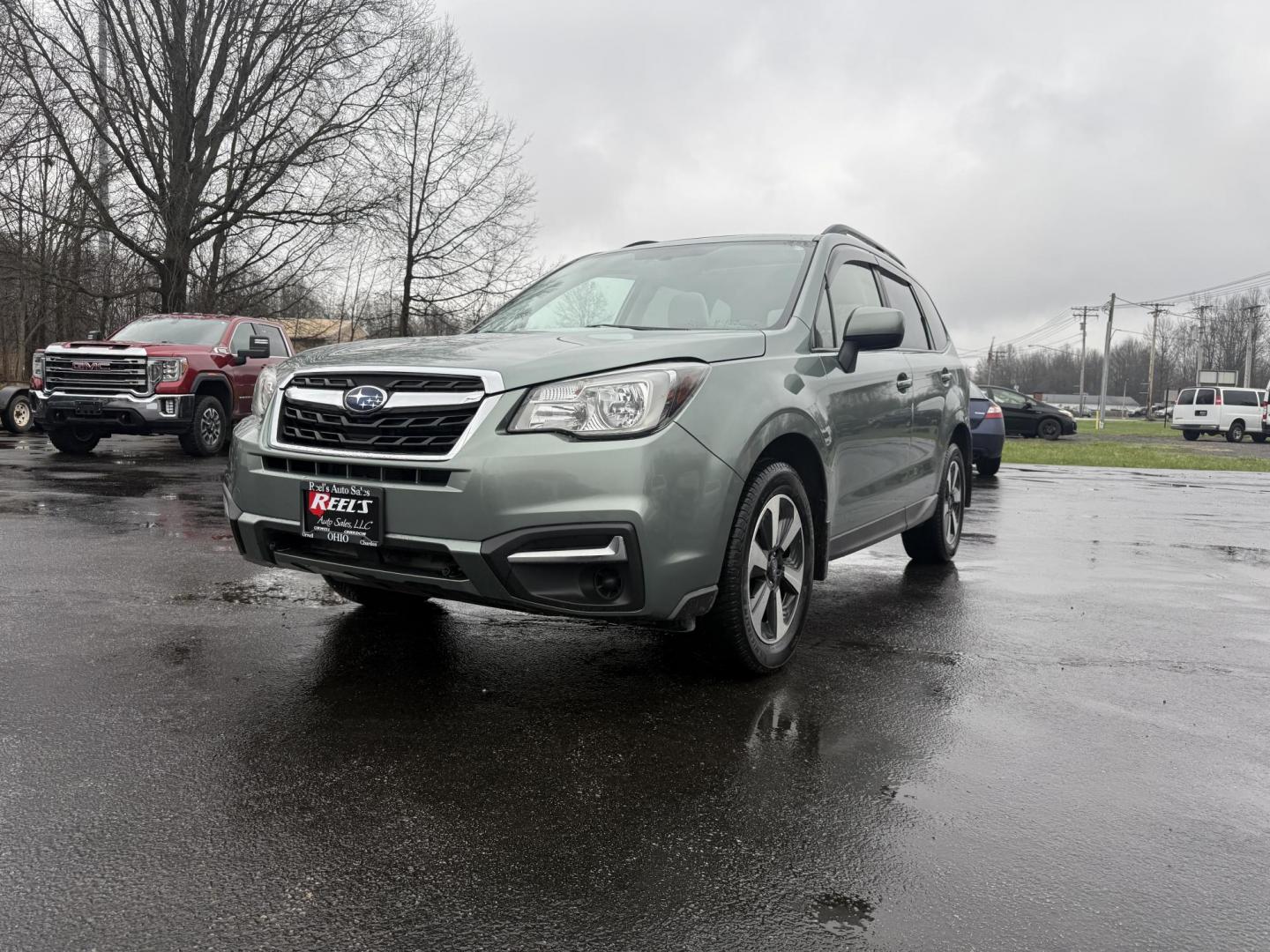 2017 Green /Gray Subaru Forester 2.5i Premium PZEV CVT (JF2SJAEC3HH) with an 2.5L H4 DOHC 16V engine, Automatic transmission, located at 547 E. Main St., Orwell, OH, 44076, (440) 437-5893, 41.535435, -80.847855 - This One Owner Subaru Forester is super fuel efficient and capable. With a 2.5-liter H4 engine and Subaru's Symmetrical All-Wheel Drive system, offering stability and traction. It features comforts like heated front seats, a 7.0-inch touchscreen for infotainment, and single-zone automatic climate co - Photo#0