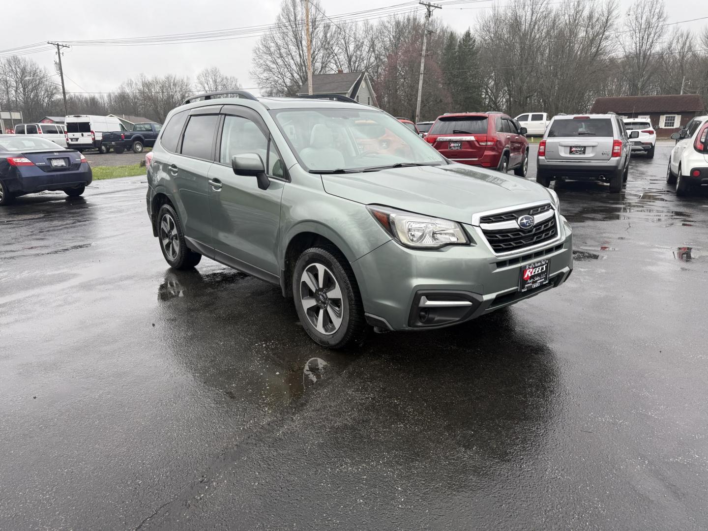 2017 Green /Gray Subaru Forester 2.5i Premium PZEV CVT (JF2SJAEC3HH) with an 2.5L H4 DOHC 16V engine, Automatic transmission, located at 547 E. Main St., Orwell, OH, 44076, (440) 437-5893, 41.535435, -80.847855 - This One Owner Subaru Forester is super fuel efficient and capable. With a 2.5-liter H4 engine and Subaru's Symmetrical All-Wheel Drive system, offering stability and traction. It features comforts like heated front seats, a 7.0-inch touchscreen for infotainment, and single-zone automatic climate co - Photo#2