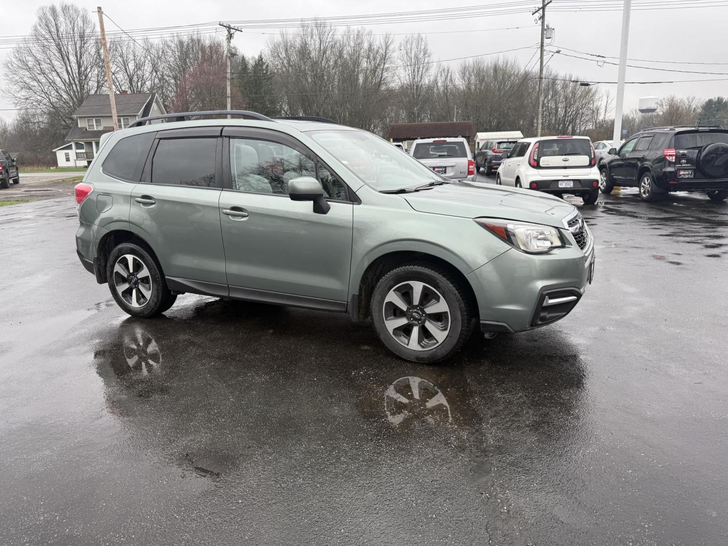 2017 Green /Gray Subaru Forester 2.5i Premium PZEV CVT (JF2SJAEC3HH) with an 2.5L H4 DOHC 16V engine, Automatic transmission, located at 547 E. Main St., Orwell, OH, 44076, (440) 437-5893, 41.535435, -80.847855 - This One Owner Subaru Forester is super fuel efficient and capable. With a 2.5-liter H4 engine and Subaru's Symmetrical All-Wheel Drive system, offering stability and traction. It features comforts like heated front seats, a 7.0-inch touchscreen for infotainment, and single-zone automatic climate co - Photo#3