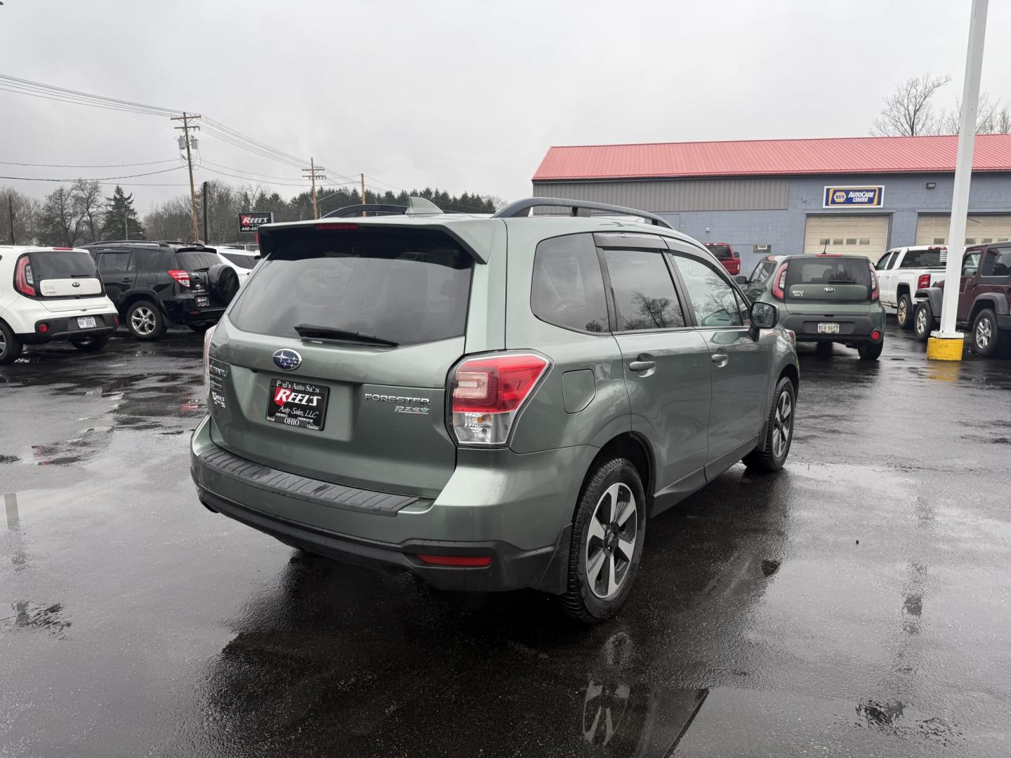 2017 Green /Gray Subaru Forester 2.5i Premium PZEV CVT (JF2SJAEC3HH) with an 2.5L H4 DOHC 16V engine, Automatic transmission, located at 547 E. Main St., Orwell, OH, 44076, (440) 437-5893, 41.535435, -80.847855 - This One Owner Subaru Forester is super fuel efficient and capable. With a 2.5-liter H4 engine and Subaru's Symmetrical All-Wheel Drive system, offering stability and traction. It features comforts like heated front seats, a 7.0-inch touchscreen for infotainment, and single-zone automatic climate co - Photo#7