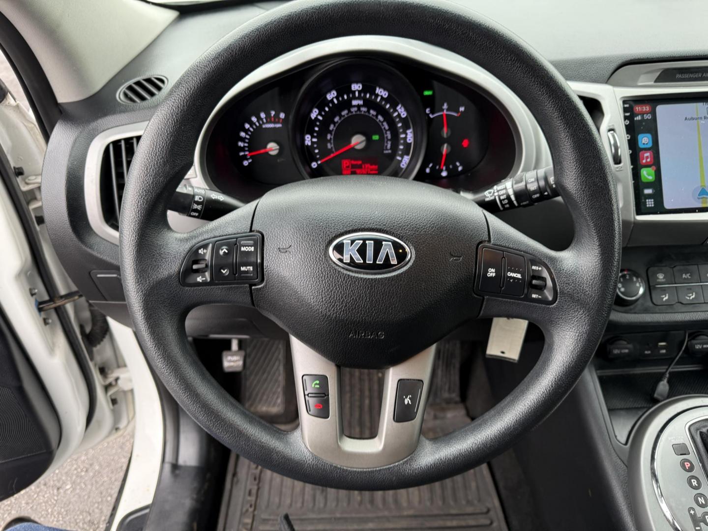 2015 White /Black Kia Sportage LX AWD (KNDPBCAC2F7) with an 2.4L I4 DOHC 16V engine, 6-Speed Automatic transmission, located at 11115 Chardon Rd. , Chardon, OH, 44024, (440) 214-9705, 41.580246, -81.241943 - This One Owner 2015 Kia Sportage LX AWD is a compact SUV equipped with a 2.4-liter inline-four GDI engine paired with a 6-speed automatic transmission. Despite being from 2015, this model offers modern amenities such as ECO driving mode for enhanced fuel efficiency and compatibility with Apple Carpl - Photo#16