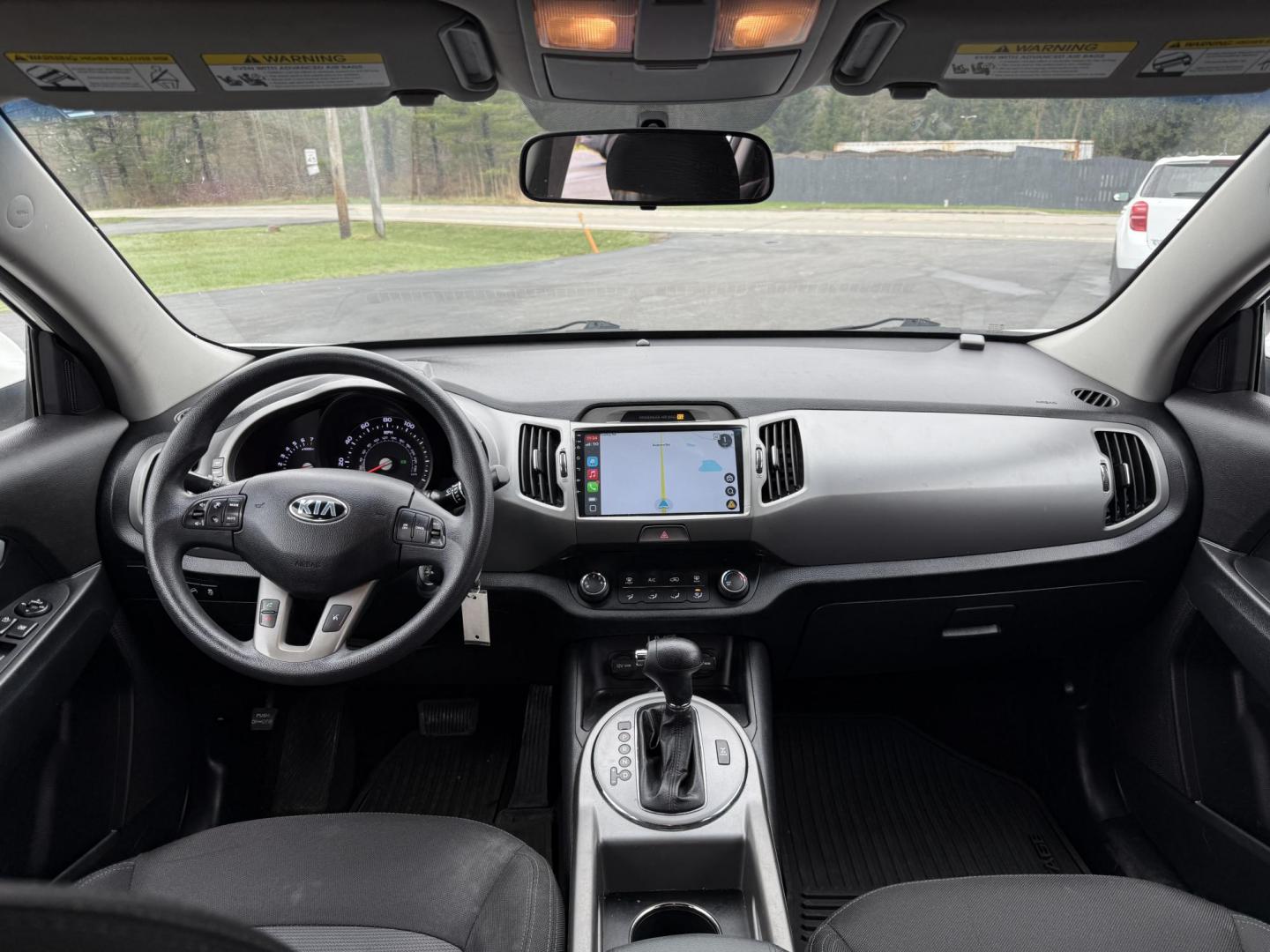 2015 White /Black Kia Sportage LX AWD (KNDPBCAC2F7) with an 2.4L I4 DOHC 16V engine, 6-Speed Automatic transmission, located at 11115 Chardon Rd. , Chardon, OH, 44024, (440) 214-9705, 41.580246, -81.241943 - This One Owner 2015 Kia Sportage LX AWD is a compact SUV equipped with a 2.4-liter inline-four GDI engine paired with a 6-speed automatic transmission. Despite being from 2015, this model offers modern amenities such as ECO driving mode for enhanced fuel efficiency and compatibility with Apple Carpl - Photo#24