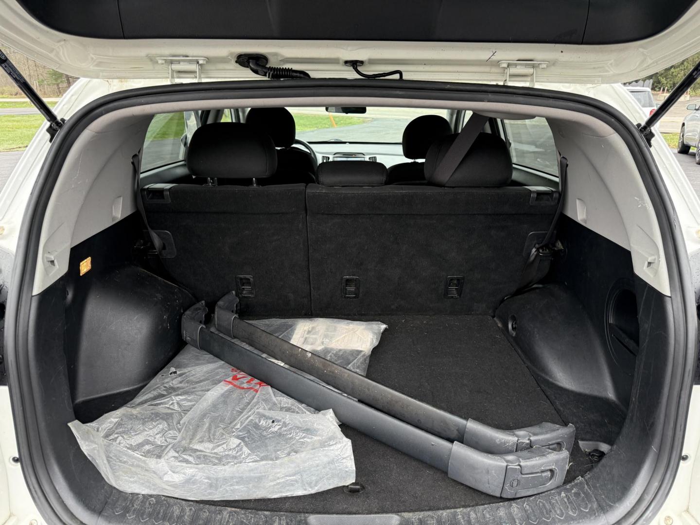 2015 White /Black Kia Sportage LX AWD (KNDPBCAC2F7) with an 2.4L I4 DOHC 16V engine, 6-Speed Automatic transmission, located at 11115 Chardon Rd. , Chardon, OH, 44024, (440) 214-9705, 41.580246, -81.241943 - This One Owner 2015 Kia Sportage LX AWD is a compact SUV equipped with a 2.4-liter inline-four GDI engine paired with a 6-speed automatic transmission. Despite being from 2015, this model offers modern amenities such as ECO driving mode for enhanced fuel efficiency and compatibility with Apple Carpl - Photo#25