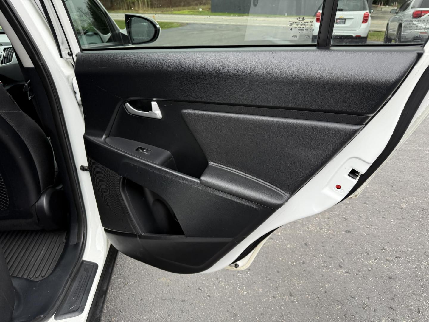 2015 White /Black Kia Sportage LX AWD (KNDPBCAC2F7) with an 2.4L I4 DOHC 16V engine, 6-Speed Automatic transmission, located at 11115 Chardon Rd. , Chardon, OH, 44024, (440) 214-9705, 41.580246, -81.241943 - This One Owner 2015 Kia Sportage LX AWD is a compact SUV equipped with a 2.4-liter inline-four GDI engine paired with a 6-speed automatic transmission. Despite being from 2015, this model offers modern amenities such as ECO driving mode for enhanced fuel efficiency and compatibility with Apple Carpl - Photo#27