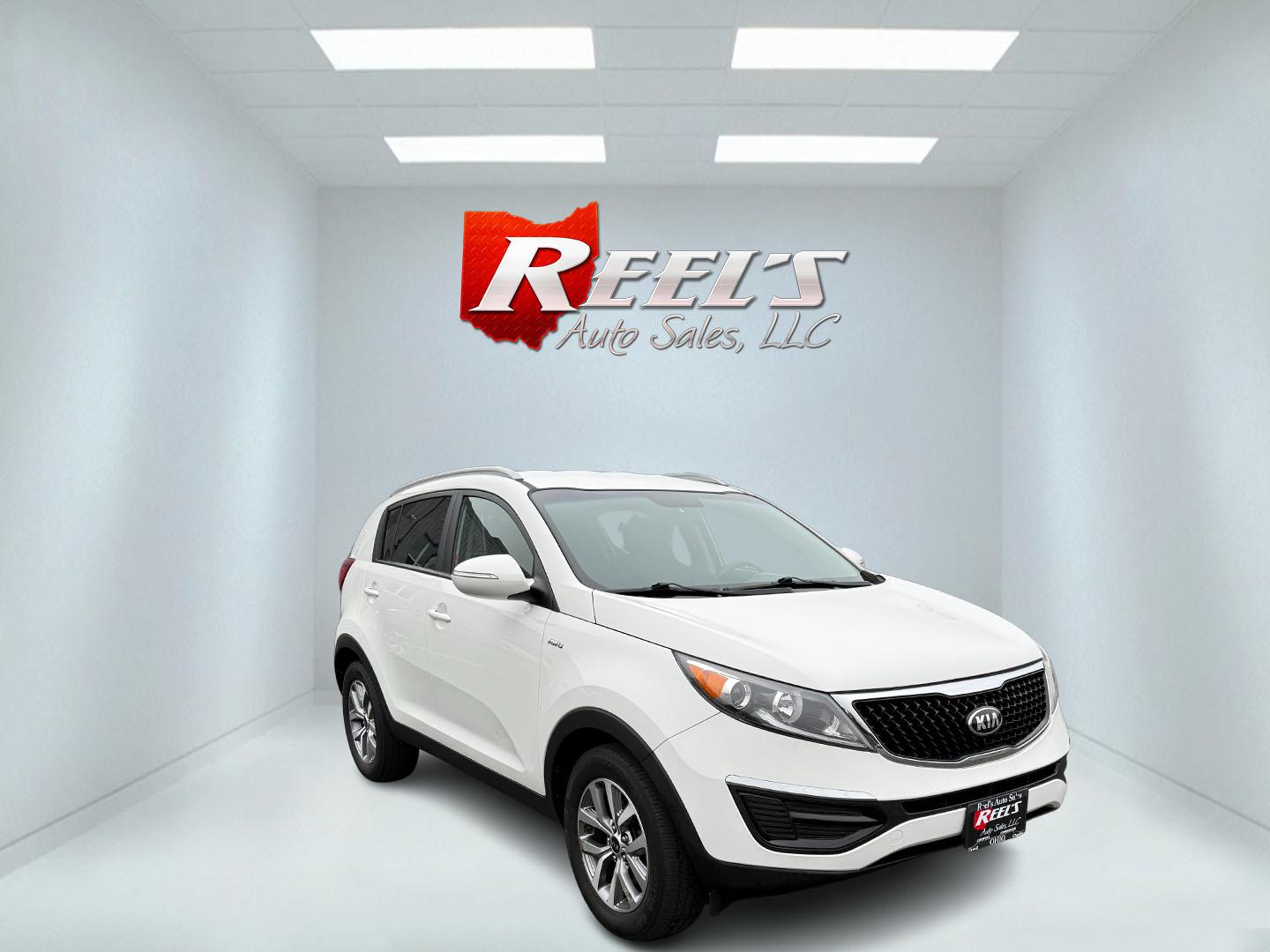2015 White /Black Kia Sportage LX AWD (KNDPBCAC2F7) with an 2.4L I4 DOHC 16V engine, 6-Speed Automatic transmission, located at 11115 Chardon Rd. , Chardon, OH, 44024, (440) 214-9705, 41.580246, -81.241943 - This One Owner 2015 Kia Sportage LX AWD is a compact SUV equipped with a 2.4-liter inline-four GDI engine paired with a 6-speed automatic transmission. Despite being from 2015, this model offers modern amenities such as ECO driving mode for enhanced fuel efficiency and compatibility with Apple Carpl - Photo#2