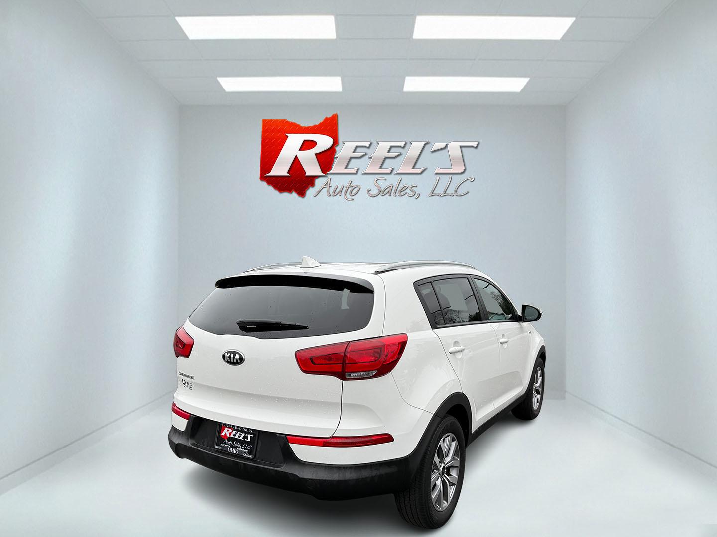 2015 White /Black Kia Sportage LX AWD (KNDPBCAC2F7) with an 2.4L I4 DOHC 16V engine, 6-Speed Automatic transmission, located at 11115 Chardon Rd. , Chardon, OH, 44024, (440) 214-9705, 41.580246, -81.241943 - This One Owner 2015 Kia Sportage LX AWD is a compact SUV equipped with a 2.4-liter inline-four GDI engine paired with a 6-speed automatic transmission. Despite being from 2015, this model offers modern amenities such as ECO driving mode for enhanced fuel efficiency and compatibility with Apple Carpl - Photo#14