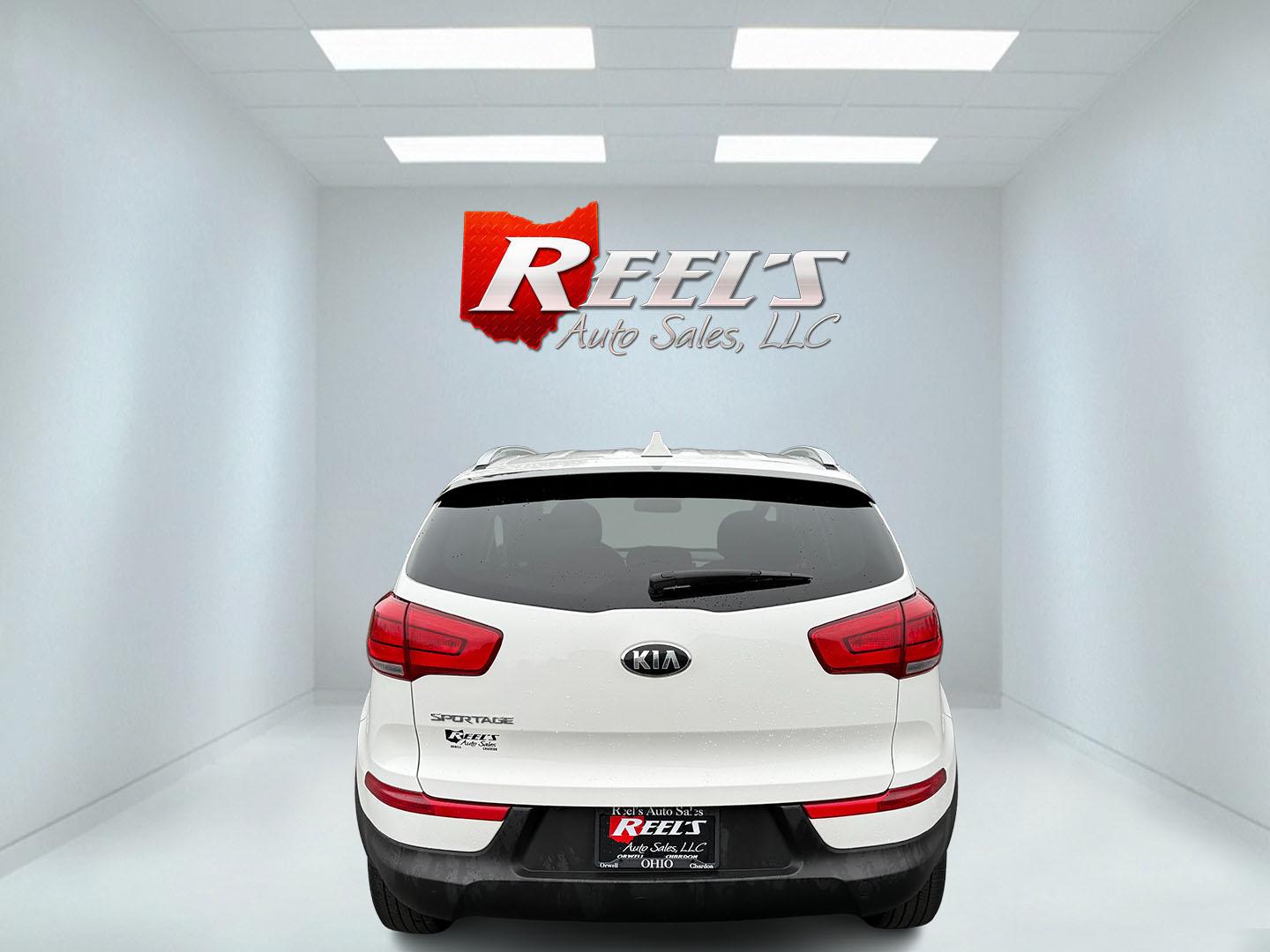 2015 White /Black Kia Sportage LX AWD (KNDPBCAC2F7) with an 2.4L I4 DOHC 16V engine, 6-Speed Automatic transmission, located at 11115 Chardon Rd. , Chardon, OH, 44024, (440) 214-9705, 41.580246, -81.241943 - This One Owner 2015 Kia Sportage LX AWD is a compact SUV equipped with a 2.4-liter inline-four GDI engine paired with a 6-speed automatic transmission. Despite being from 2015, this model offers modern amenities such as ECO driving mode for enhanced fuel efficiency and compatibility with Apple Carpl - Photo#33