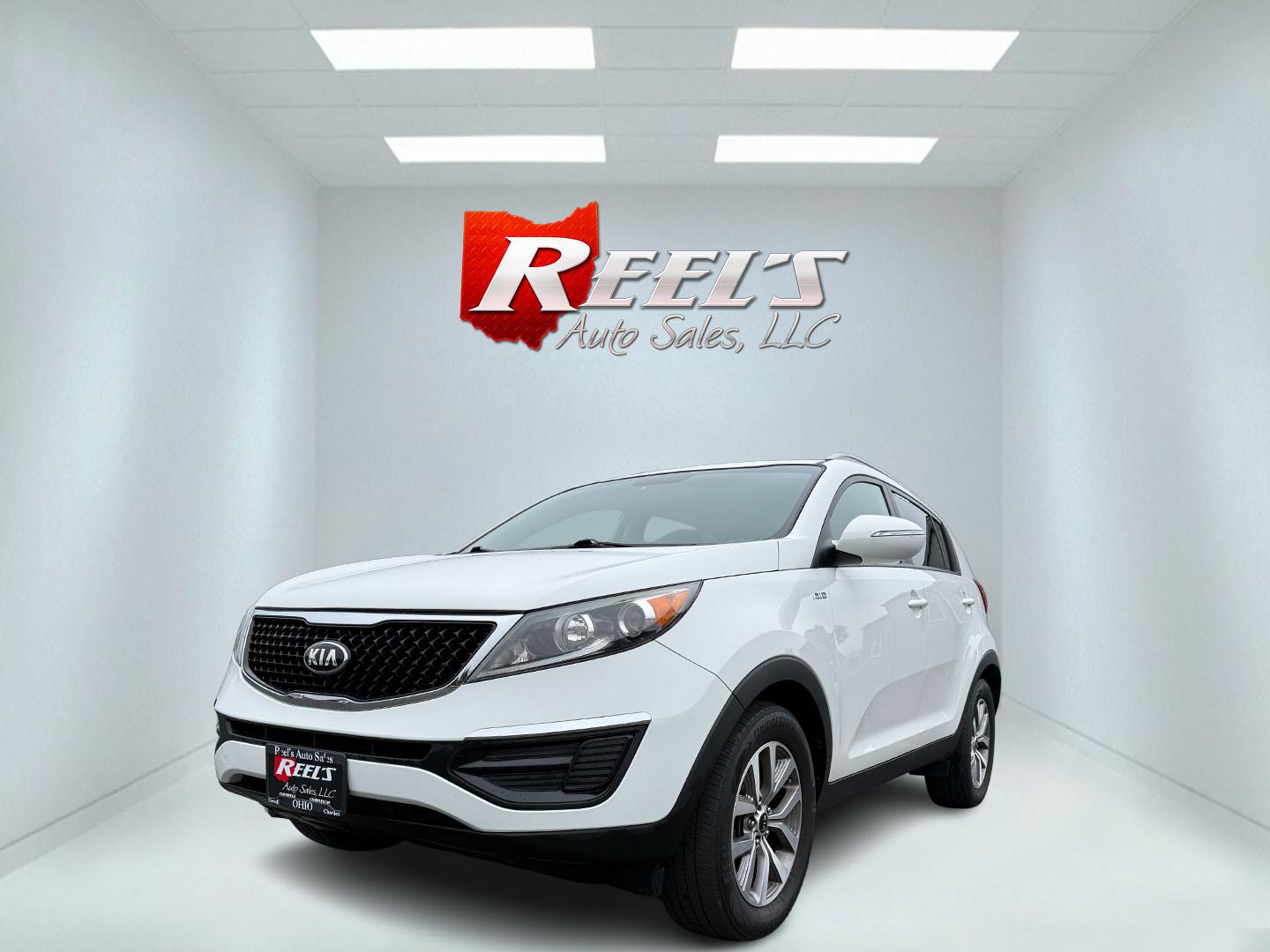 2015 White /Black Kia Sportage LX AWD (KNDPBCAC2F7) with an 2.4L I4 DOHC 16V engine, 6-Speed Automatic transmission, located at 11115 Chardon Rd. , Chardon, OH, 44024, (440) 214-9705, 41.580246, -81.241943 - This One Owner 2015 Kia Sportage LX AWD is a compact SUV equipped with a 2.4-liter inline-four GDI engine paired with a 6-speed automatic transmission. Despite being from 2015, this model offers modern amenities such as ECO driving mode for enhanced fuel efficiency and compatibility with Apple Carpl - Photo#0