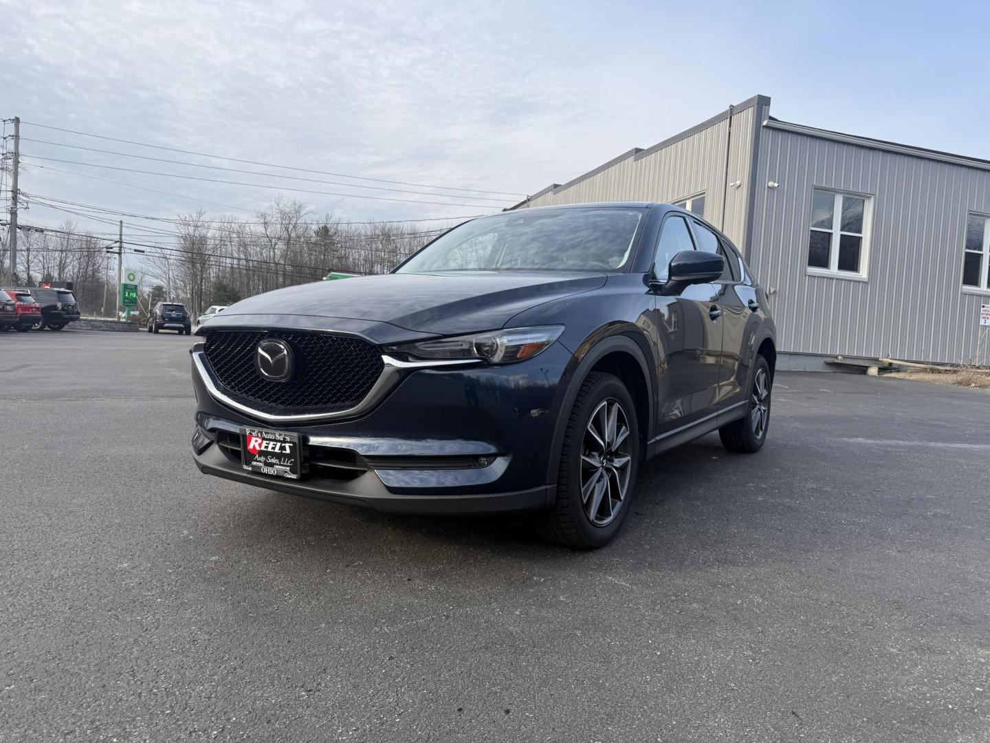 2018 Blue /Black Mazda CX-5 Grand Touring AWD (JM3KFBDM0J0) with an 2.5L I4 DOHC 16V engine, 6A transmission, located at 11115 Chardon Rd. , Chardon, OH, 44024, (440) 214-9705, 41.580246, -81.241943 - Photo#0