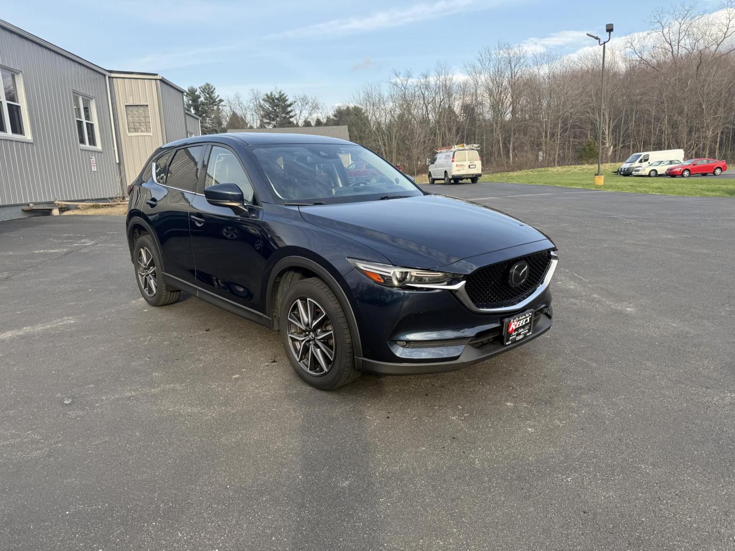 2018 Blue /Black Mazda CX-5 Grand Touring AWD (JM3KFBDM0J0) with an 2.5L I4 DOHC 16V engine, 6A transmission, located at 11115 Chardon Rd. , Chardon, OH, 44024, (440) 214-9705, 41.580246, -81.241943 - Photo#1
