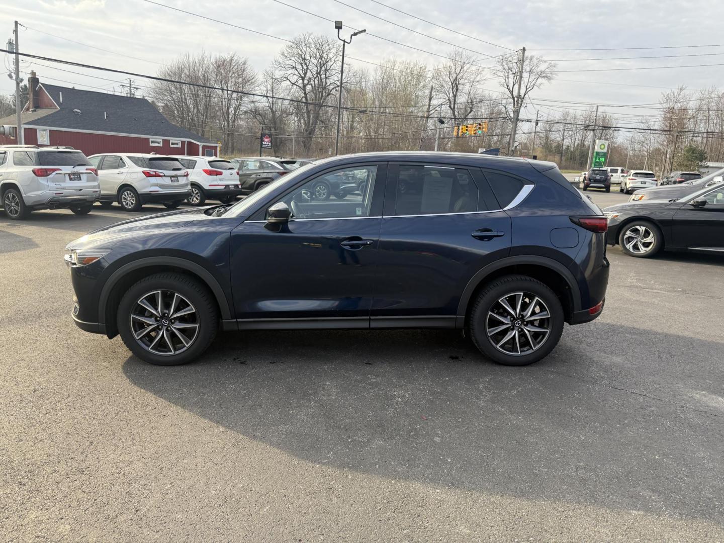 2018 Blue /Black Mazda CX-5 Grand Touring AWD (JM3KFBDM0J0) with an 2.5L I4 DOHC 16V engine, 6A transmission, located at 11115 Chardon Rd. , Chardon, OH, 44024, (440) 214-9705, 41.580246, -81.241943 - Photo#12