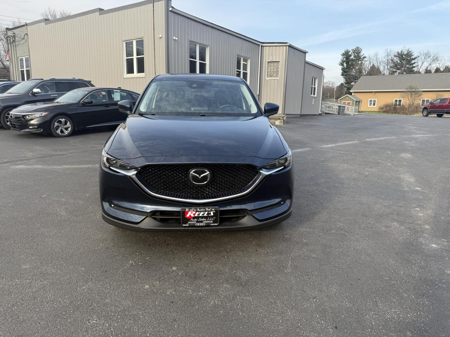 2018 Blue /Black Mazda CX-5 Grand Touring AWD (JM3KFBDM0J0) with an 2.5L I4 DOHC 16V engine, 6A transmission, located at 11115 Chardon Rd. , Chardon, OH, 44024, (440) 214-9705, 41.580246, -81.241943 - Photo#2