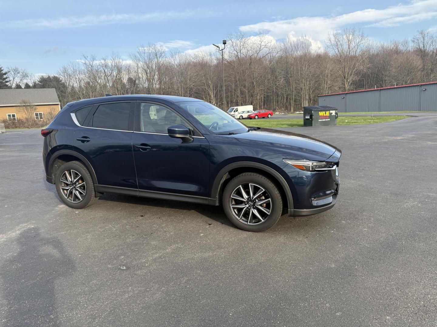 2018 Blue /Black Mazda CX-5 Grand Touring AWD (JM3KFBDM0J0) with an 2.5L I4 DOHC 16V engine, 6A transmission, located at 11115 Chardon Rd. , Chardon, OH, 44024, (440) 214-9705, 41.580246, -81.241943 - Photo#3