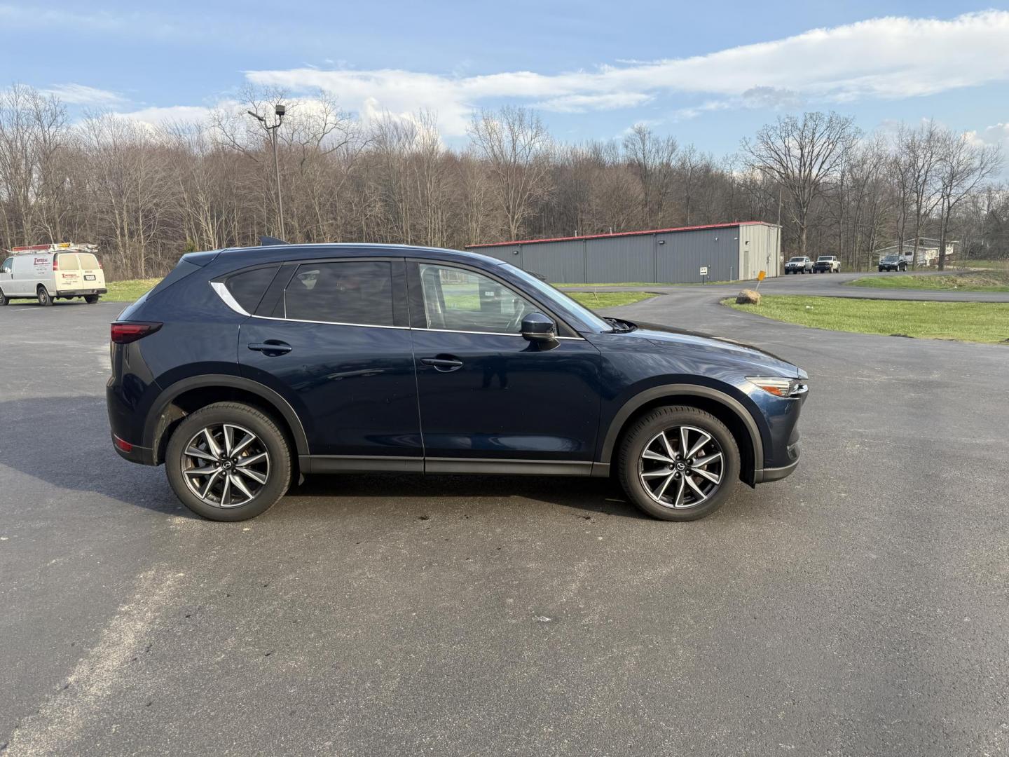 2018 Blue /Black Mazda CX-5 Grand Touring AWD (JM3KFBDM0J0) with an 2.5L I4 DOHC 16V engine, 6A transmission, located at 11115 Chardon Rd. , Chardon, OH, 44024, (440) 214-9705, 41.580246, -81.241943 - Photo#5