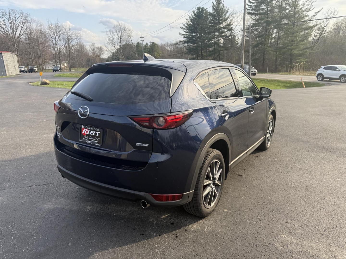 2018 Blue /Black Mazda CX-5 Grand Touring AWD (JM3KFBDM0J0) with an 2.5L I4 DOHC 16V engine, 6A transmission, located at 11115 Chardon Rd. , Chardon, OH, 44024, (440) 214-9705, 41.580246, -81.241943 - Photo#7