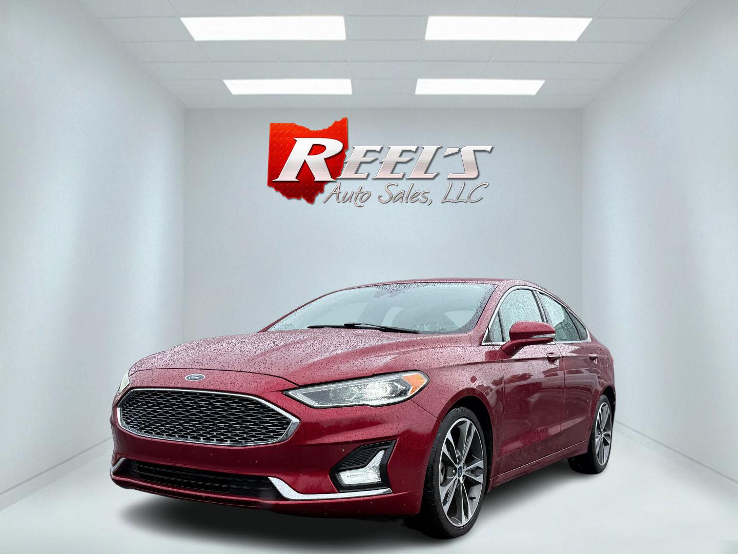 2019 Red /Brown Ford Fusion Titanium AWD (3FA6P0D91KR) with an 2.0L I4 DOHC 16V Turbo engine, 6A transmission, located at 11115 Chardon Rd. , Chardon, OH, 44024, (440) 214-9705, 41.580246, -81.241943 - This Ford Fusion is out of Florida and looks and drives like a dream. Its turbocharged 2.0L I4 engine, 6-speed automatic transmission, and all-wheel drive combine for confident handling. Inside, you'll find a luxurious leather interior with heated and cooled front seats, an advanced 12-speaker Sony - Photo#0