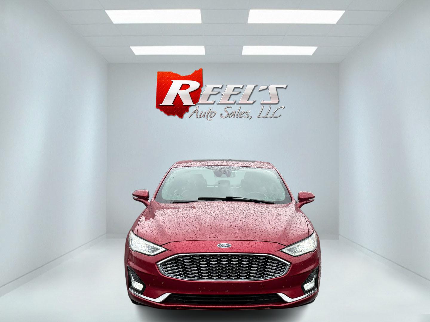 2019 Red /Brown Ford Fusion Titanium AWD (3FA6P0D91KR) with an 2.0L I4 DOHC 16V Turbo engine, 6A transmission, located at 11115 Chardon Rd. , Chardon, OH, 44024, (440) 214-9705, 41.580246, -81.241943 - This Ford Fusion is out of Florida and looks and drives like a dream. Its turbocharged 2.0L I4 engine, 6-speed automatic transmission, and all-wheel drive combine for confident handling. Inside, you'll find a luxurious leather interior with heated and cooled front seats, an advanced 12-speaker Sony - Photo#1