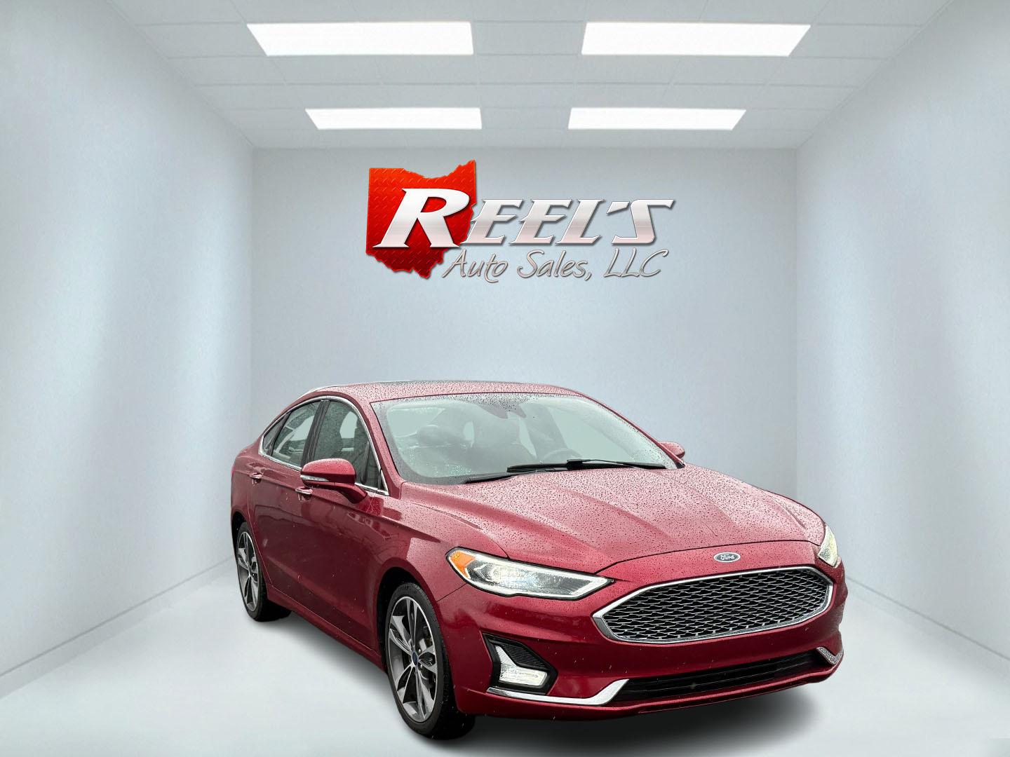 2019 Red /Brown Ford Fusion Titanium AWD (3FA6P0D91KR) with an 2.0L I4 DOHC 16V Turbo engine, 6A transmission, located at 11115 Chardon Rd. , Chardon, OH, 44024, (440) 214-9705, 41.580246, -81.241943 - This Ford Fusion is out of Florida and looks and drives like a dream. Its turbocharged 2.0L I4 engine, 6-speed automatic transmission, and all-wheel drive combine for confident handling. Inside, you'll find a luxurious leather interior with heated and cooled front seats, an advanced 12-speaker Sony - Photo#2