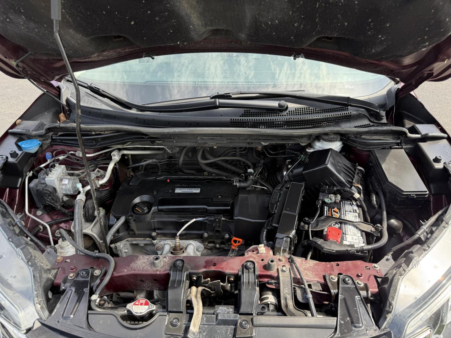 2016 Red /Gray Honda CR-V Touring AWD (5J6RM4H98GL) with an 2.4L I4 DOHC 16V engine, Automatic transmission, located at 11115 Chardon Rd. , Chardon, OH, 44024, (440) 214-9705, 41.580246, -81.241943 - This Honda CR-V has luxury car features with Honda's legendary reliability. With the 2.4L I4 EarthDreams VTEC engine offers a well-rounded combination of comfort, convenience, and advanced safety features, including a leather interior, heated front seats, a power driver’s seat with memory, sunroof - Photo#3
