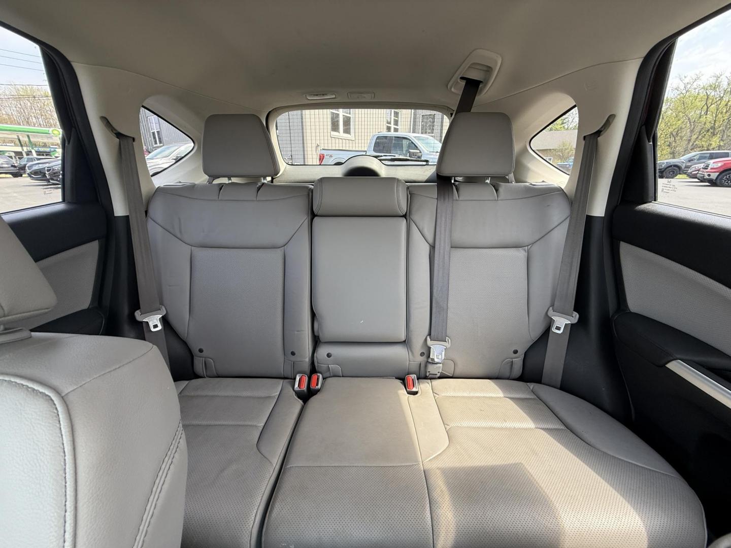 2016 Red /Gray Honda CR-V Touring AWD (5J6RM4H98GL) with an 2.4L I4 DOHC 16V engine, Automatic transmission, located at 11115 Chardon Rd. , Chardon, OH, 44024, (440) 214-9705, 41.580246, -81.241943 - This Honda CR-V has luxury car features with Honda's legendary reliability. With the 2.4L I4 EarthDreams VTEC engine offers a well-rounded combination of comfort, convenience, and advanced safety features, including a leather interior, heated front seats, a power driver’s seat with memory, sunroof - Photo#33