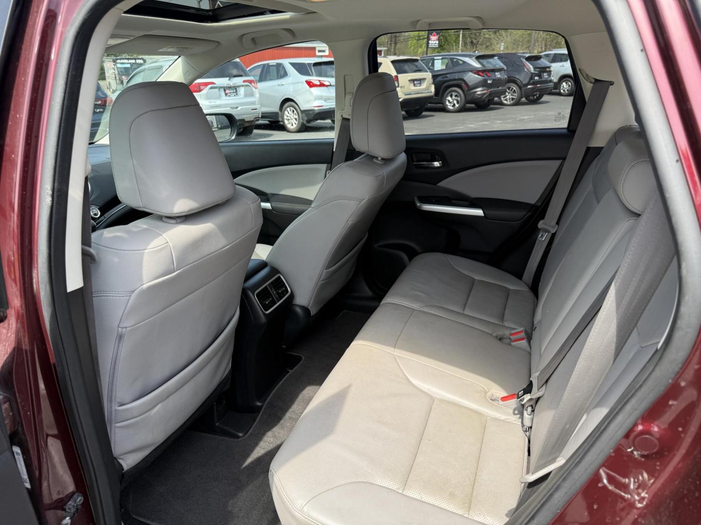 2016 Red /Gray Honda CR-V Touring AWD (5J6RM4H98GL) with an 2.4L I4 DOHC 16V engine, Automatic transmission, located at 11115 Chardon Rd. , Chardon, OH, 44024, (440) 214-9705, 41.580246, -81.241943 - This Honda CR-V has luxury car features with Honda's legendary reliability. With the 2.4L I4 EarthDreams VTEC engine offers a well-rounded combination of comfort, convenience, and advanced safety features, including a leather interior, heated front seats, a power driver’s seat with memory, sunroof - Photo#34