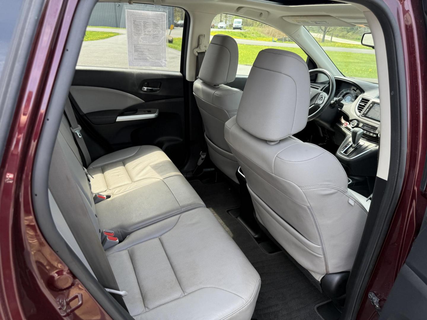 2016 Red /Gray Honda CR-V Touring AWD (5J6RM4H98GL) with an 2.4L I4 DOHC 16V engine, Automatic transmission, located at 11115 Chardon Rd. , Chardon, OH, 44024, (440) 214-9705, 41.580246, -81.241943 - This Honda CR-V has luxury car features with Honda's legendary reliability. With the 2.4L I4 EarthDreams VTEC engine offers a well-rounded combination of comfort, convenience, and advanced safety features, including a leather interior, heated front seats, a power driver’s seat with memory, sunroof - Photo#40