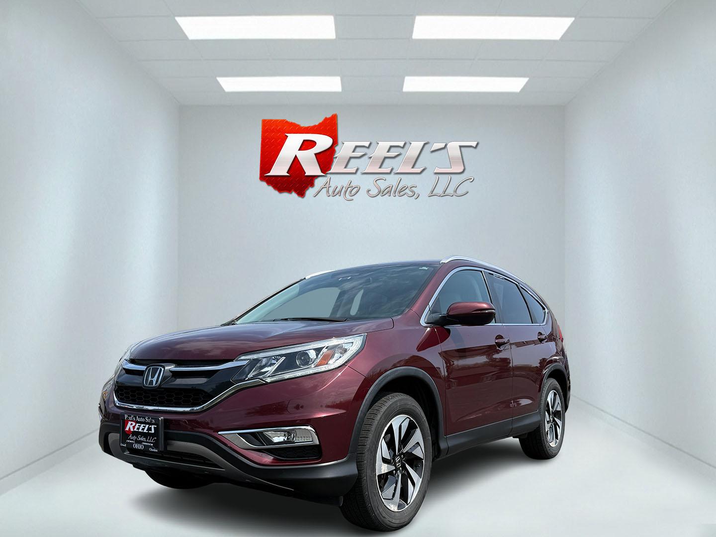 2016 Red /Gray Honda CR-V Touring AWD (5J6RM4H98GL) with an 2.4L I4 DOHC 16V engine, Automatic transmission, located at 11115 Chardon Rd. , Chardon, OH, 44024, (440) 214-9705, 41.580246, -81.241943 - This Honda CR-V has luxury car features with Honda's legendary reliability. With the 2.4L I4 EarthDreams VTEC engine offers a well-rounded combination of comfort, convenience, and advanced safety features, including a leather interior, heated front seats, a power driver’s seat with memory, sunroof - Photo#0