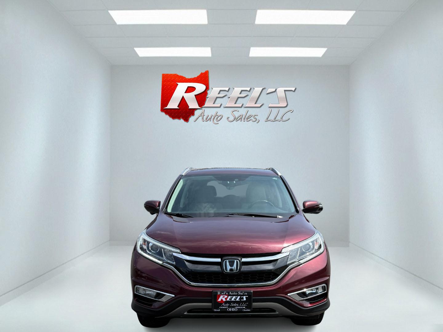 2016 Red /Gray Honda CR-V Touring AWD (5J6RM4H98GL) with an 2.4L I4 DOHC 16V engine, Automatic transmission, located at 11115 Chardon Rd. , Chardon, OH, 44024, (440) 214-9705, 41.580246, -81.241943 - This Honda CR-V has luxury car features with Honda's legendary reliability. With the 2.4L I4 EarthDreams VTEC engine offers a well-rounded combination of comfort, convenience, and advanced safety features, including a leather interior, heated front seats, a power driver’s seat with memory, sunroof - Photo#1