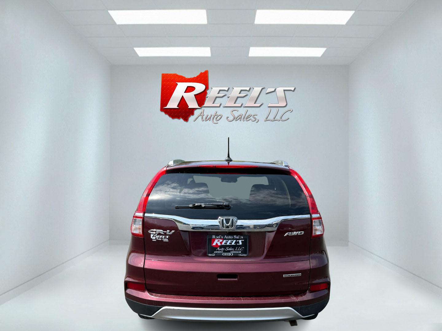 2016 Red /Gray Honda CR-V Touring AWD (5J6RM4H98GL) with an 2.4L I4 DOHC 16V engine, Automatic transmission, located at 11115 Chardon Rd. , Chardon, OH, 44024, (440) 214-9705, 41.580246, -81.241943 - This Honda CR-V has luxury car features with Honda's legendary reliability. With the 2.4L I4 EarthDreams VTEC engine offers a well-rounded combination of comfort, convenience, and advanced safety features, including a leather interior, heated front seats, a power driver’s seat with memory, sunroof - Photo#46