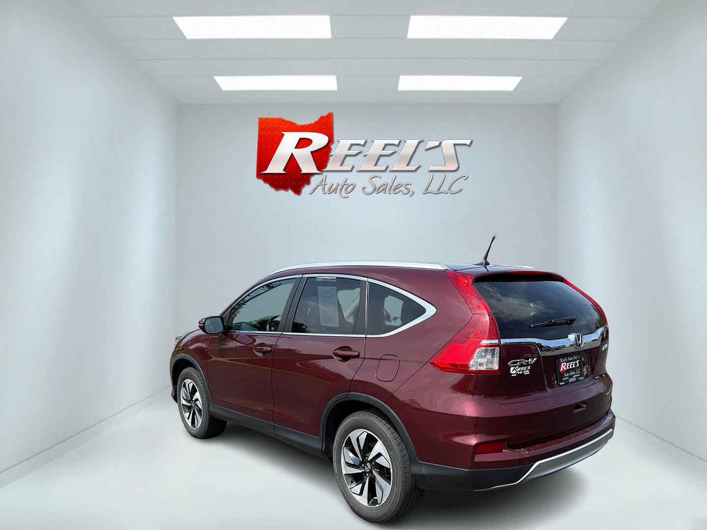 2016 Red /Gray Honda CR-V Touring AWD (5J6RM4H98GL) with an 2.4L I4 DOHC 16V engine, Automatic transmission, located at 11115 Chardon Rd. , Chardon, OH, 44024, (440) 214-9705, 41.580246, -81.241943 - This Honda CR-V has luxury car features with Honda's legendary reliability. With the 2.4L I4 EarthDreams VTEC engine offers a well-rounded combination of comfort, convenience, and advanced safety features, including a leather interior, heated front seats, a power driver’s seat with memory, sunroof - Photo#47
