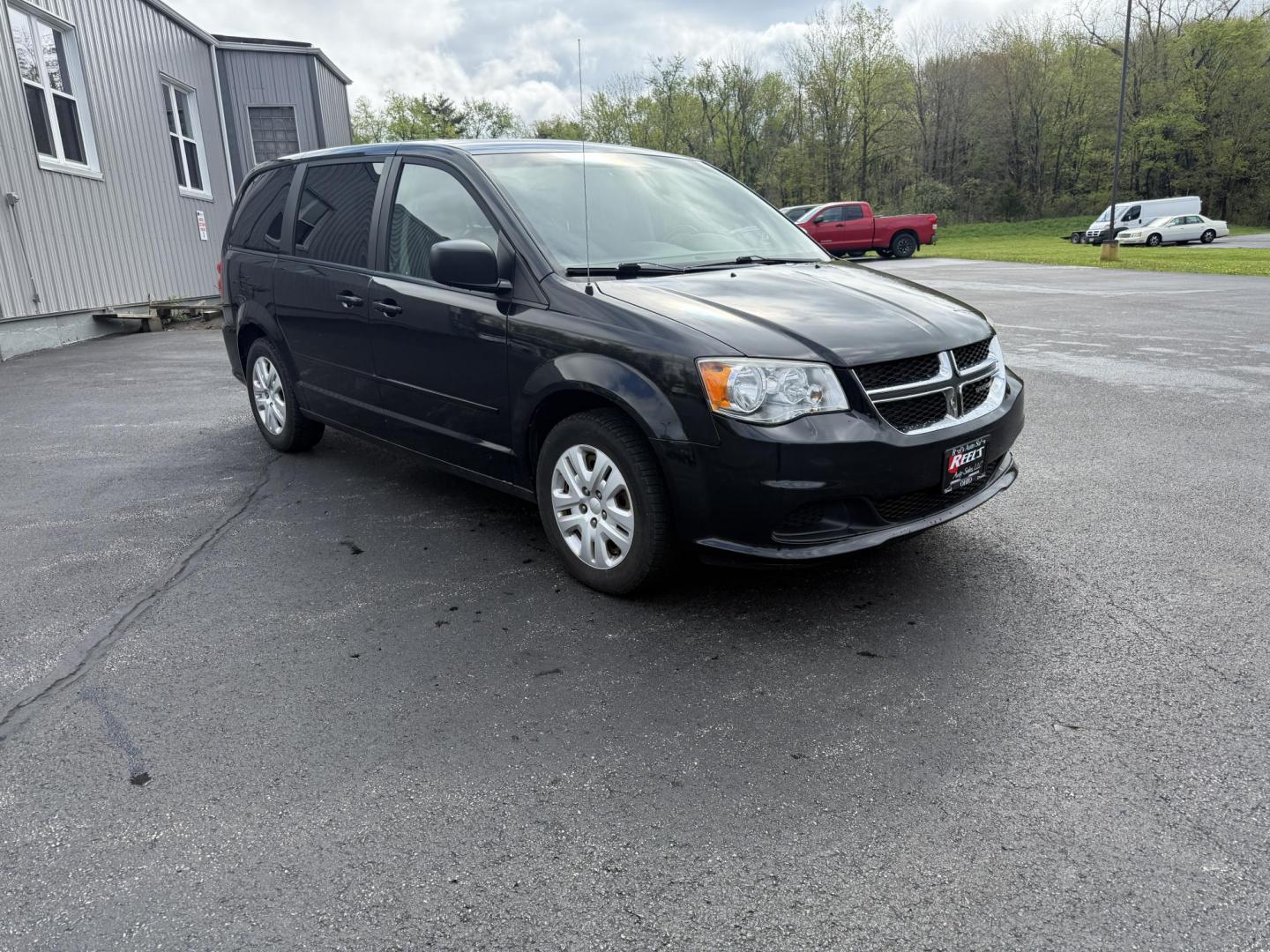 2014 Black /Black Dodge Grand Caravan SE (2C4RDGBG5ER) with an 3.6L V6 DOHC 24V FFV engine, 6-Speed Automatic transmission, located at 11115 Chardon Rd. , Chardon, OH, 44024, (440) 214-9705, 41.580246, -81.241943 - This One Owner 2014 Dodge Grand Caravan is ready for any adventure your family needs. Equipped with a 3.6L Pentastar V6 engine and a 6-speed automatic transmission, offering reliable performance and flex-fuel capability. It features practical amenities such as STOW 'N GO' seating for flexible cargo - Photo#2
