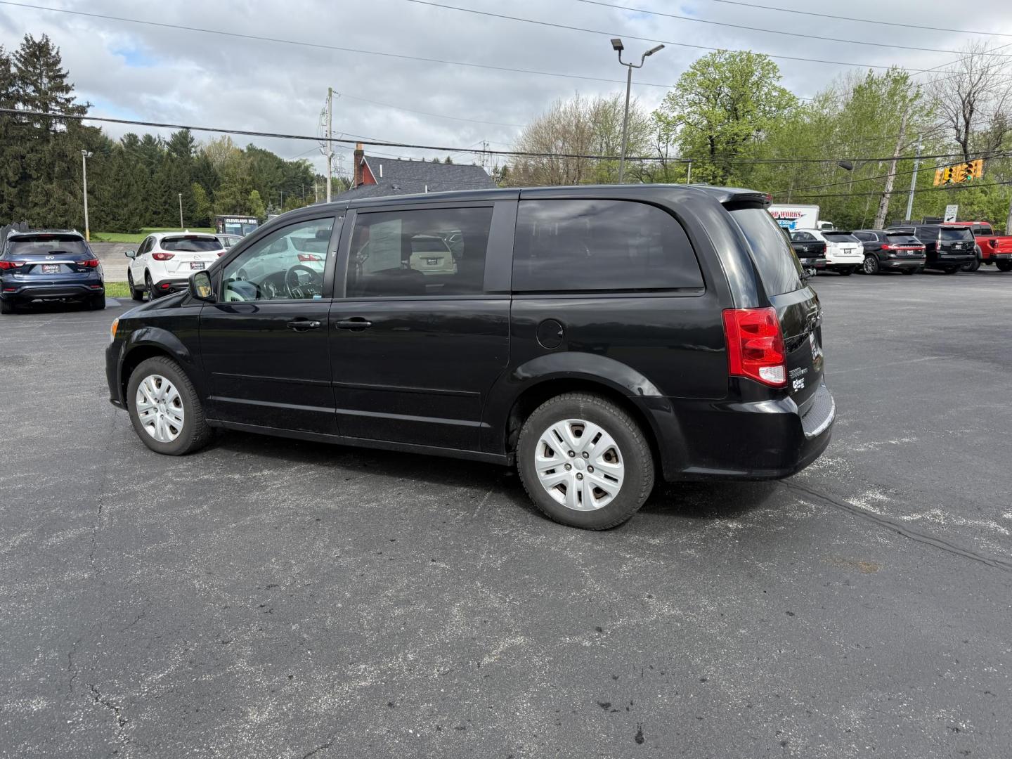 2014 Black /Black Dodge Grand Caravan SE (2C4RDGBG5ER) with an 3.6L V6 DOHC 24V FFV engine, 6-Speed Automatic transmission, located at 11115 Chardon Rd. , Chardon, OH, 44024, (440) 214-9705, 41.580246, -81.241943 - This One Owner 2014 Dodge Grand Caravan is ready for any adventure your family needs. Equipped with a 3.6L Pentastar V6 engine and a 6-speed automatic transmission, offering reliable performance and flex-fuel capability. It features practical amenities such as STOW 'N GO' seating for flexible cargo - Photo#10