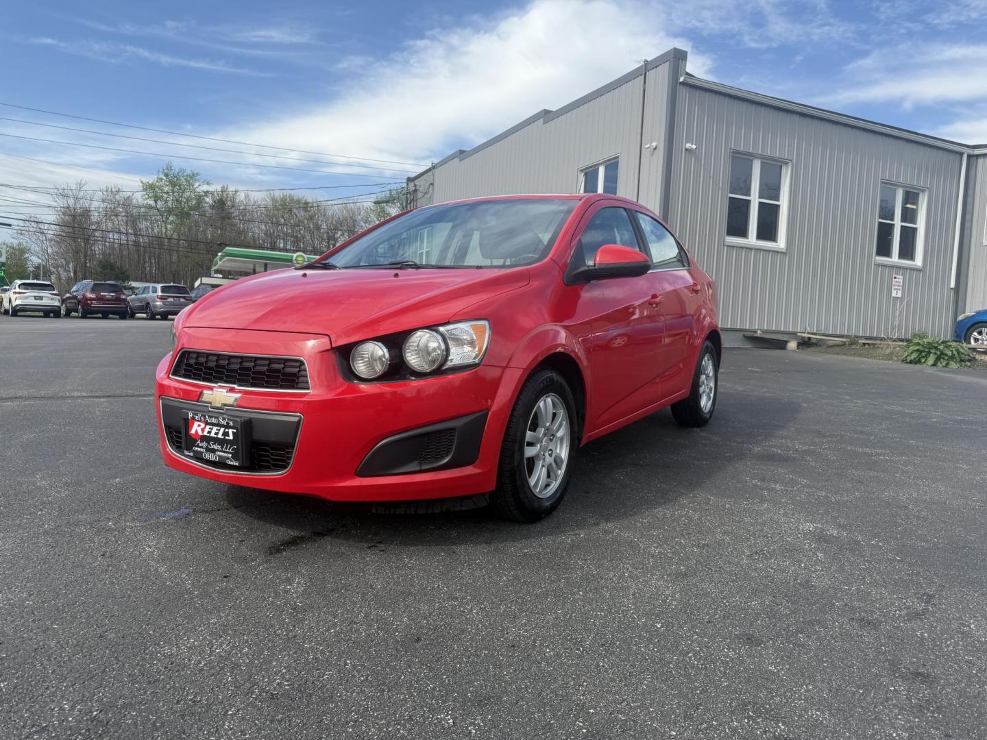 2015 Red /Black Chevrolet Sonic LT Auto Sedan (1G1JC5SH8F4) with an 1.8L I4 DOHC 24V engine, 6-Speed Automatic transmission, located at 11115 Chardon Rd. , Chardon, OH, 44024, (440) 214-9705, 41.580246, -81.241943 - FRESH TRADE IN ALERT ---- This 2015 Chevrolet Sonic LT Sedan with a 1.8L I4 EcoTec engine and 6-speed automatic transmission offers a blend of efficiency and convenience, achieving up to 34 MPG on the highway. Standard features include daytime running lights, dusk-sensing headlights for enhanced sa - Photo#0