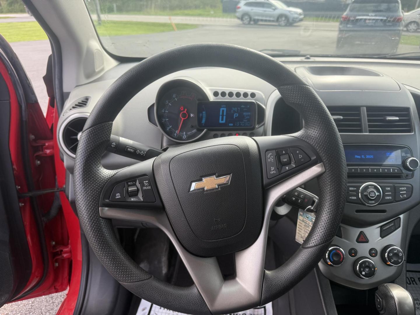 2015 Red /Black Chevrolet Sonic LT Auto Sedan (1G1JC5SH8F4) with an 1.8L I4 DOHC 24V engine, 6-Speed Automatic transmission, located at 11115 Chardon Rd. , Chardon, OH, 44024, (440) 214-9705, 41.580246, -81.241943 - FRESH TRADE IN ALERT ---- This 2015 Chevrolet Sonic LT Sedan with a 1.8L I4 EcoTec engine and 6-speed automatic transmission offers a blend of efficiency and convenience, achieving up to 34 MPG on the highway. Standard features include daytime running lights, dusk-sensing headlights for enhanced sa - Photo#21