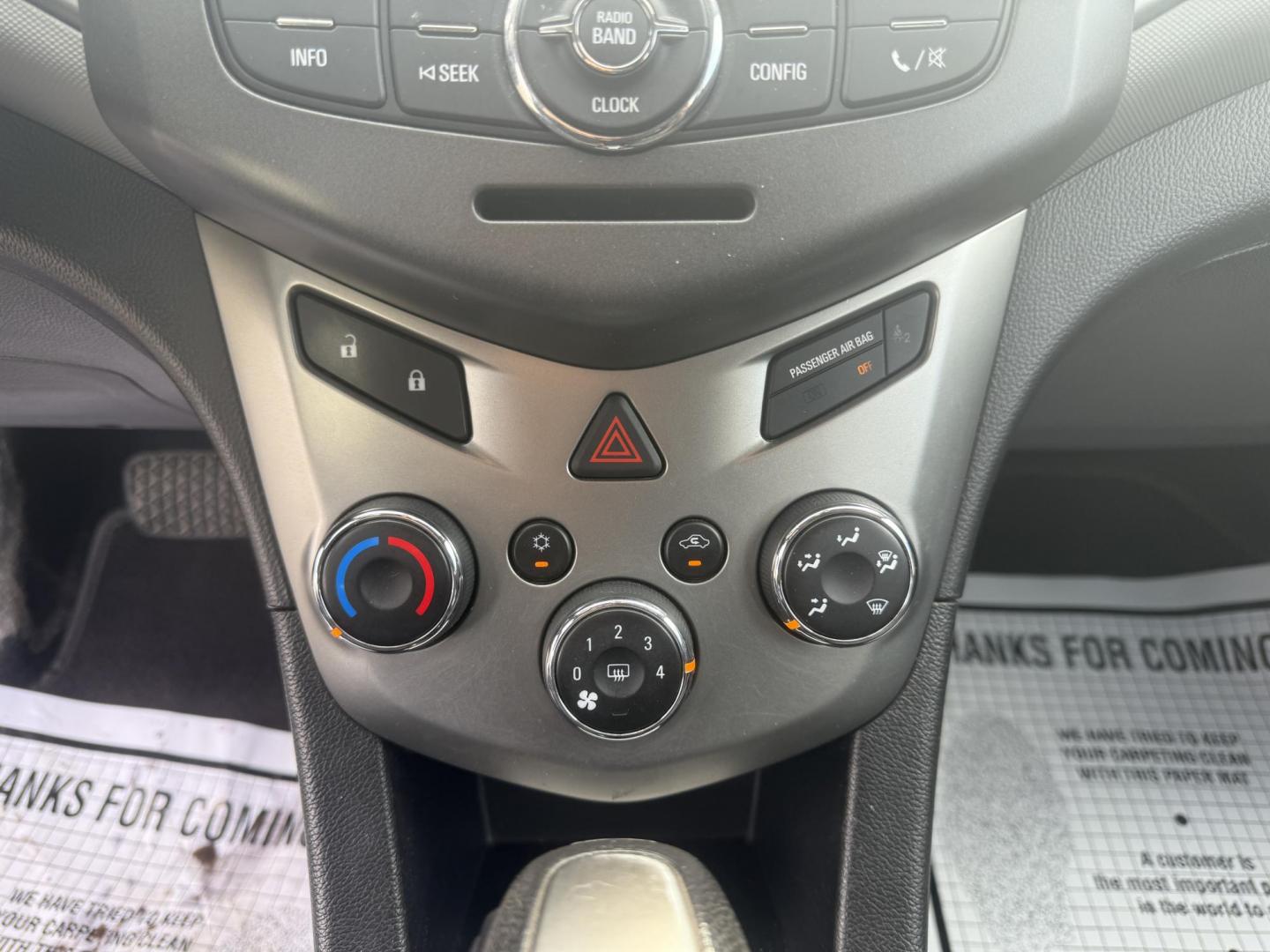2015 Red /Black Chevrolet Sonic LT Auto Sedan (1G1JC5SH8F4) with an 1.8L I4 DOHC 24V engine, 6-Speed Automatic transmission, located at 11115 Chardon Rd. , Chardon, OH, 44024, (440) 214-9705, 41.580246, -81.241943 - FRESH TRADE IN ALERT ---- This 2015 Chevrolet Sonic LT Sedan with a 1.8L I4 EcoTec engine and 6-speed automatic transmission offers a blend of efficiency and convenience, achieving up to 34 MPG on the highway. Standard features include daytime running lights, dusk-sensing headlights for enhanced sa - Photo#23