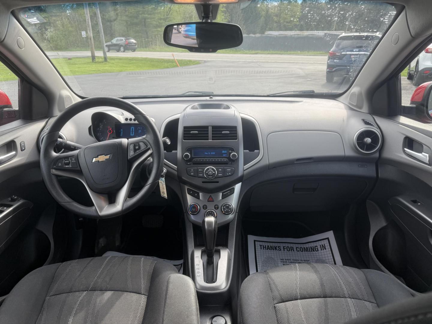 2015 Red /Black Chevrolet Sonic LT Auto Sedan (1G1JC5SH8F4) with an 1.8L I4 DOHC 24V engine, 6-Speed Automatic transmission, located at 11115 Chardon Rd. , Chardon, OH, 44024, (440) 214-9705, 41.580246, -81.241943 - FRESH TRADE IN ALERT ---- This 2015 Chevrolet Sonic LT Sedan with a 1.8L I4 EcoTec engine and 6-speed automatic transmission offers a blend of efficiency and convenience, achieving up to 34 MPG on the highway. Standard features include daytime running lights, dusk-sensing headlights for enhanced sa - Photo#29