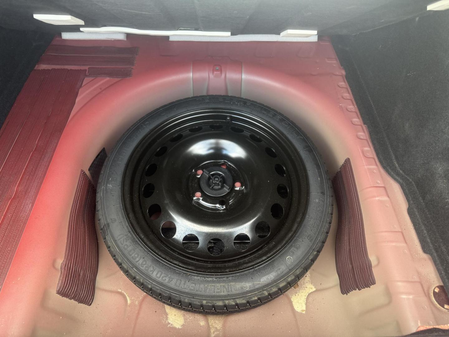 2015 Red /Black Chevrolet Sonic LT Auto Sedan (1G1JC5SH8F4) with an 1.8L I4 DOHC 24V engine, 6-Speed Automatic transmission, located at 11115 Chardon Rd. , Chardon, OH, 44024, (440) 214-9705, 41.580246, -81.241943 - FRESH TRADE IN ALERT ---- This 2015 Chevrolet Sonic LT Sedan with a 1.8L I4 EcoTec engine and 6-speed automatic transmission offers a blend of efficiency and convenience, achieving up to 34 MPG on the highway. Standard features include daytime running lights, dusk-sensing headlights for enhanced sa - Photo#31