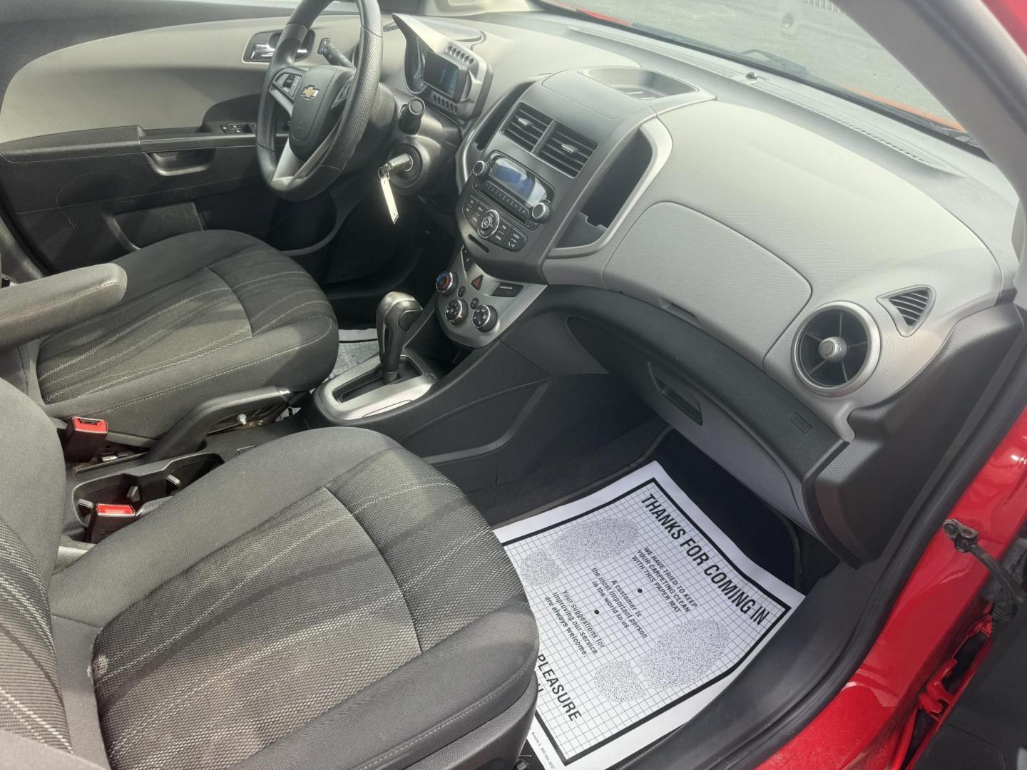 2015 Red /Black Chevrolet Sonic LT Auto Sedan (1G1JC5SH8F4) with an 1.8L I4 DOHC 24V engine, 6-Speed Automatic transmission, located at 11115 Chardon Rd. , Chardon, OH, 44024, (440) 214-9705, 41.580246, -81.241943 - FRESH TRADE IN ALERT ---- This 2015 Chevrolet Sonic LT Sedan with a 1.8L I4 EcoTec engine and 6-speed automatic transmission offers a blend of efficiency and convenience, achieving up to 34 MPG on the highway. Standard features include daytime running lights, dusk-sensing headlights for enhanced sa - Photo#34