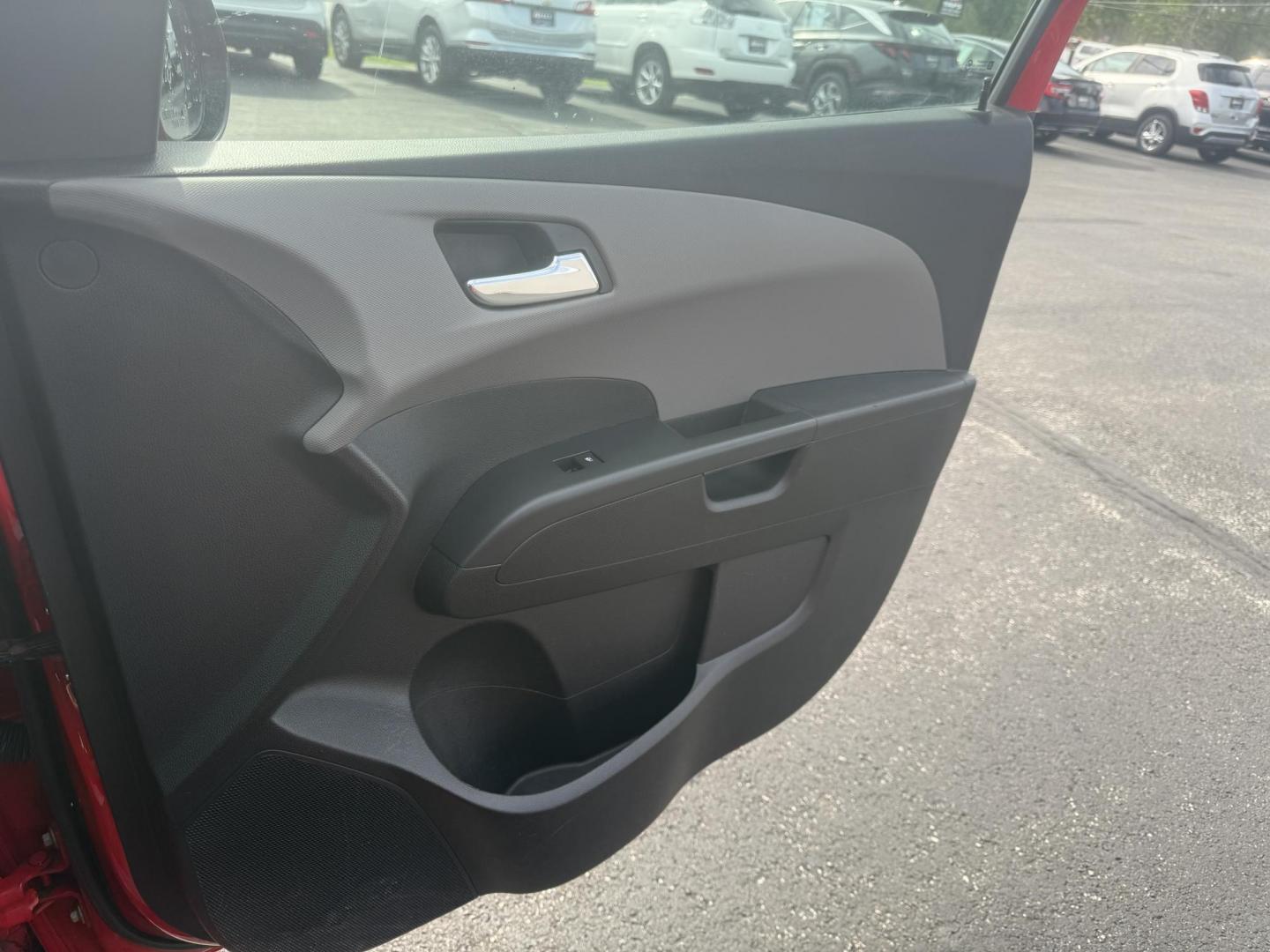 2015 Red /Black Chevrolet Sonic LT Auto Sedan (1G1JC5SH8F4) with an 1.8L I4 DOHC 24V engine, 6-Speed Automatic transmission, located at 11115 Chardon Rd. , Chardon, OH, 44024, (440) 214-9705, 41.580246, -81.241943 - FRESH TRADE IN ALERT ---- This 2015 Chevrolet Sonic LT Sedan with a 1.8L I4 EcoTec engine and 6-speed automatic transmission offers a blend of efficiency and convenience, achieving up to 34 MPG on the highway. Standard features include daytime running lights, dusk-sensing headlights for enhanced sa - Photo#38