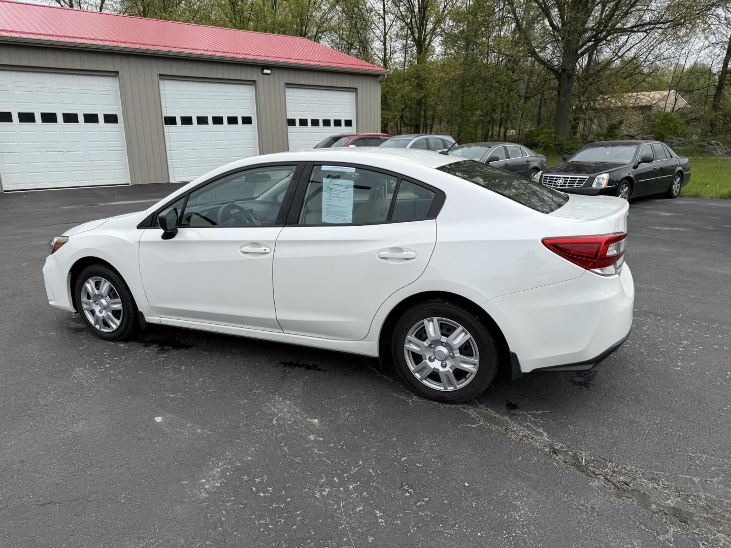 2017 White /Gray Subaru Impreza 2.0i 4-Door (4S3GKAA60H3) with an 2.0L H4 DOHC 16V engine, Automatic transmission, located at 547 E. Main St., Orwell, OH, 44076, (440) 437-5893, 41.535435, -80.847855 - This little 2017 Subaru Imprezza is a modern and fuel efficient sedan. Equipped with a 2.0-liter H4 engine and Subaru’s Symmetrical All-Wheel Drive system, offering confident handling and stability. It boasts impressive fuel efficiency, achieving up to 38 MPG on the highway. Standard features incl - Photo#10