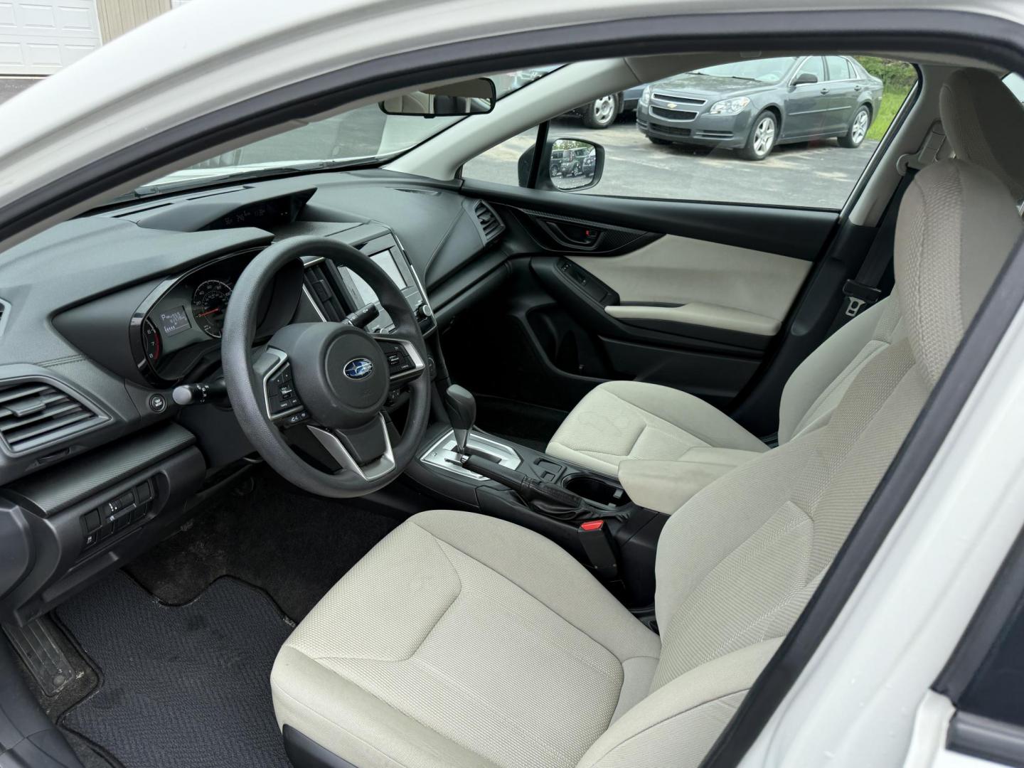 2017 White /Gray Subaru Impreza 2.0i 4-Door (4S3GKAA60H3) with an 2.0L H4 DOHC 16V engine, Automatic transmission, located at 547 E. Main St., Orwell, OH, 44076, (440) 437-5893, 41.535435, -80.847855 - This little 2017 Subaru Imprezza is a modern and fuel efficient sedan. Equipped with a 2.0-liter H4 engine and Subaru’s Symmetrical All-Wheel Drive system, offering confident handling and stability. It boasts impressive fuel efficiency, achieving up to 38 MPG on the highway. Standard features incl - Photo#15