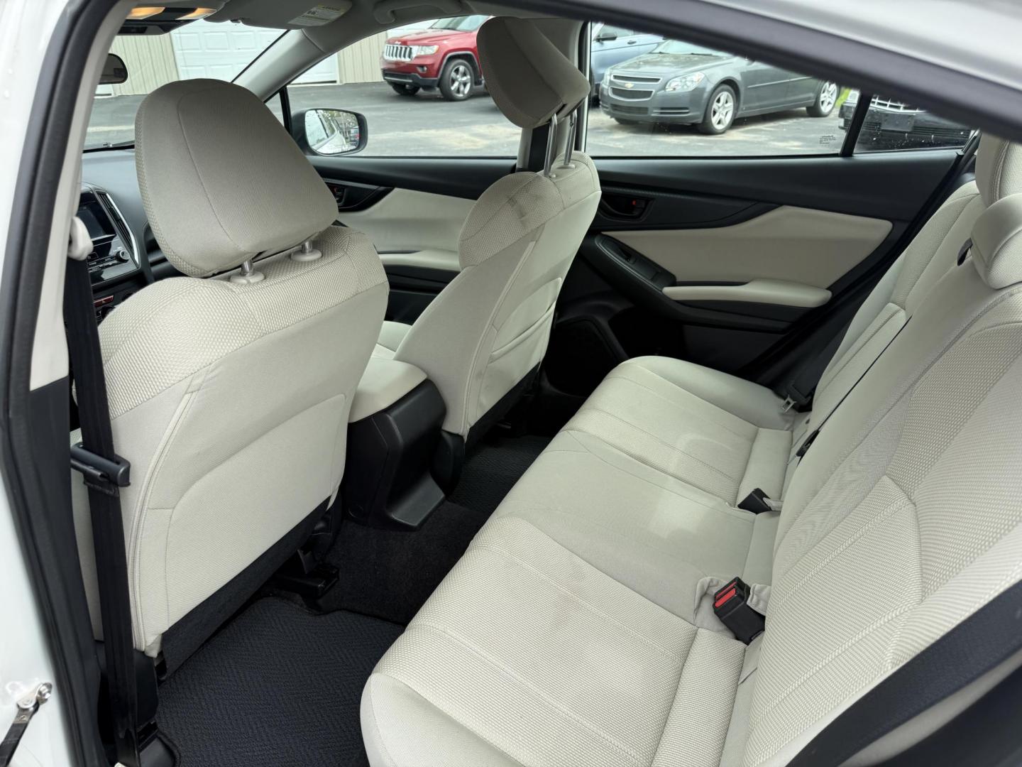 2017 White /Gray Subaru Impreza 2.0i 4-Door (4S3GKAA60H3) with an 2.0L H4 DOHC 16V engine, Automatic transmission, located at 547 E. Main St., Orwell, OH, 44076, (440) 437-5893, 41.535435, -80.847855 - This little 2017 Subaru Imprezza is a modern and fuel efficient sedan. Equipped with a 2.0-liter H4 engine and Subaru’s Symmetrical All-Wheel Drive system, offering confident handling and stability. It boasts impressive fuel efficiency, achieving up to 38 MPG on the highway. Standard features incl - Photo#26