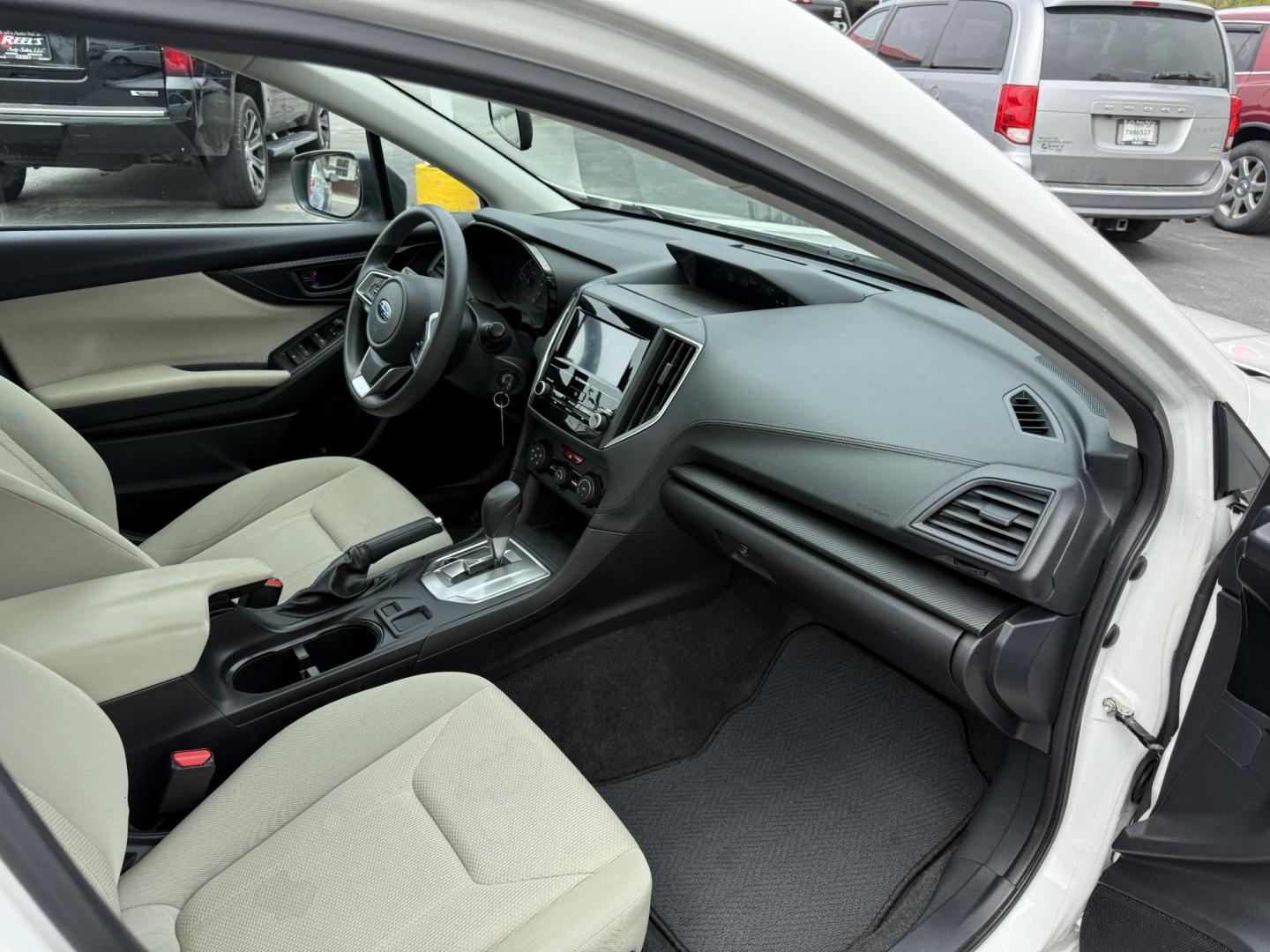 2017 White /Gray Subaru Impreza 2.0i 4-Door (4S3GKAA60H3) with an 2.0L H4 DOHC 16V engine, Automatic transmission, located at 547 E. Main St., Orwell, OH, 44076, (440) 437-5893, 41.535435, -80.847855 - This little 2017 Subaru Imprezza is a modern and fuel efficient sedan. Equipped with a 2.0-liter H4 engine and Subaru’s Symmetrical All-Wheel Drive system, offering confident handling and stability. It boasts impressive fuel efficiency, achieving up to 38 MPG on the highway. Standard features incl - Photo#32