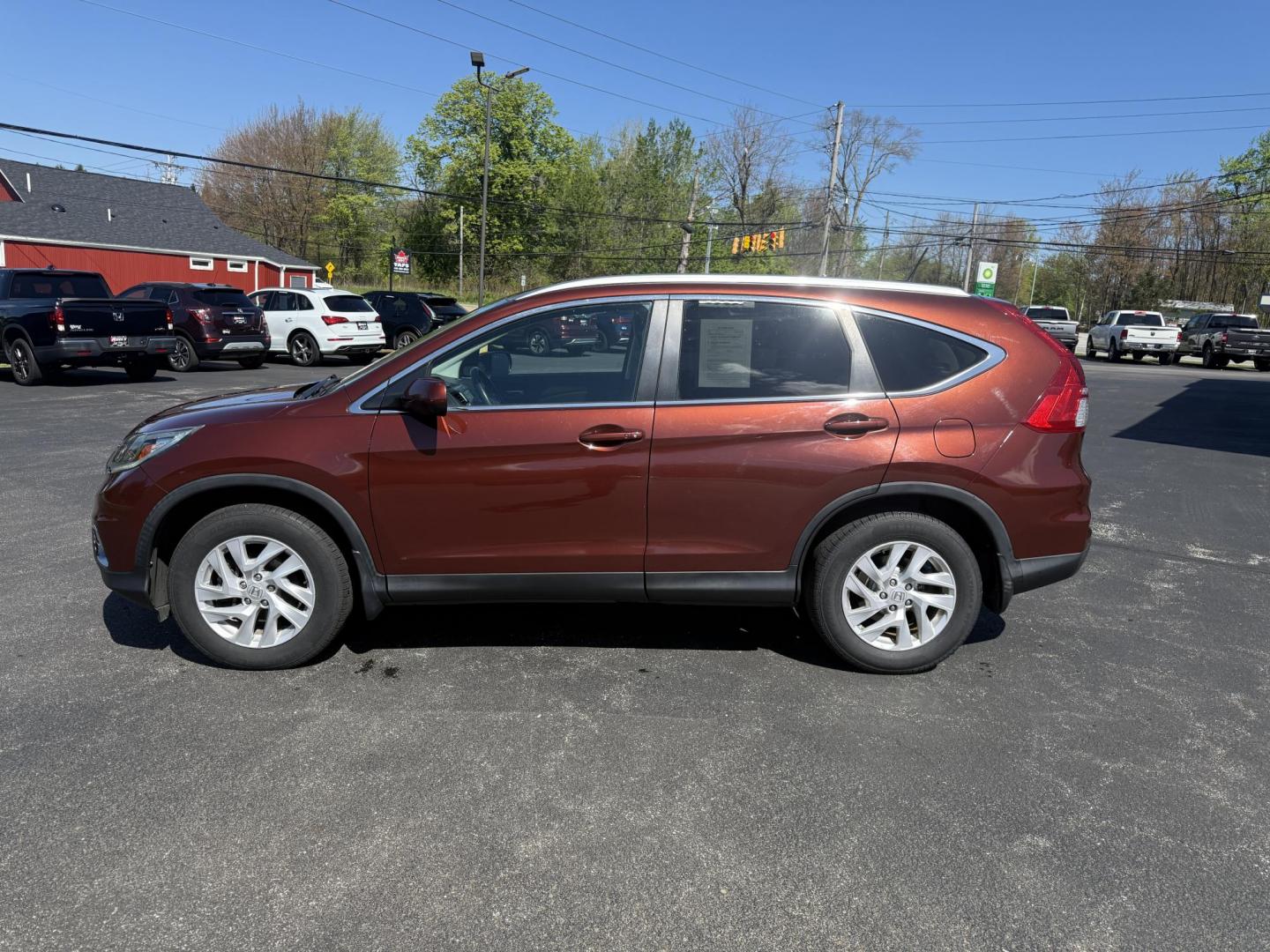 2015 Red /Black Honda CR-V EX-L 4WD (2HKRM4H73FH) with an 2.4L I4 DOHC 16V engine, Automatic transmission, located at 11115 Chardon Rd. , Chardon, OH, 44024, (440) 214-9705, 41.580246, -81.241943 - This One Owner 2015 Honda CR-V EX-L AWD has luxury, reliability and, fuel efficiency. Powered by Honda's incredible 2.4 I4 Engine and CVT (Continuously Variable Transmission) it achieves up to 32 MPG Highway while still have all weather capability due to it's all wheel drive system. With a leather i - Photo#11