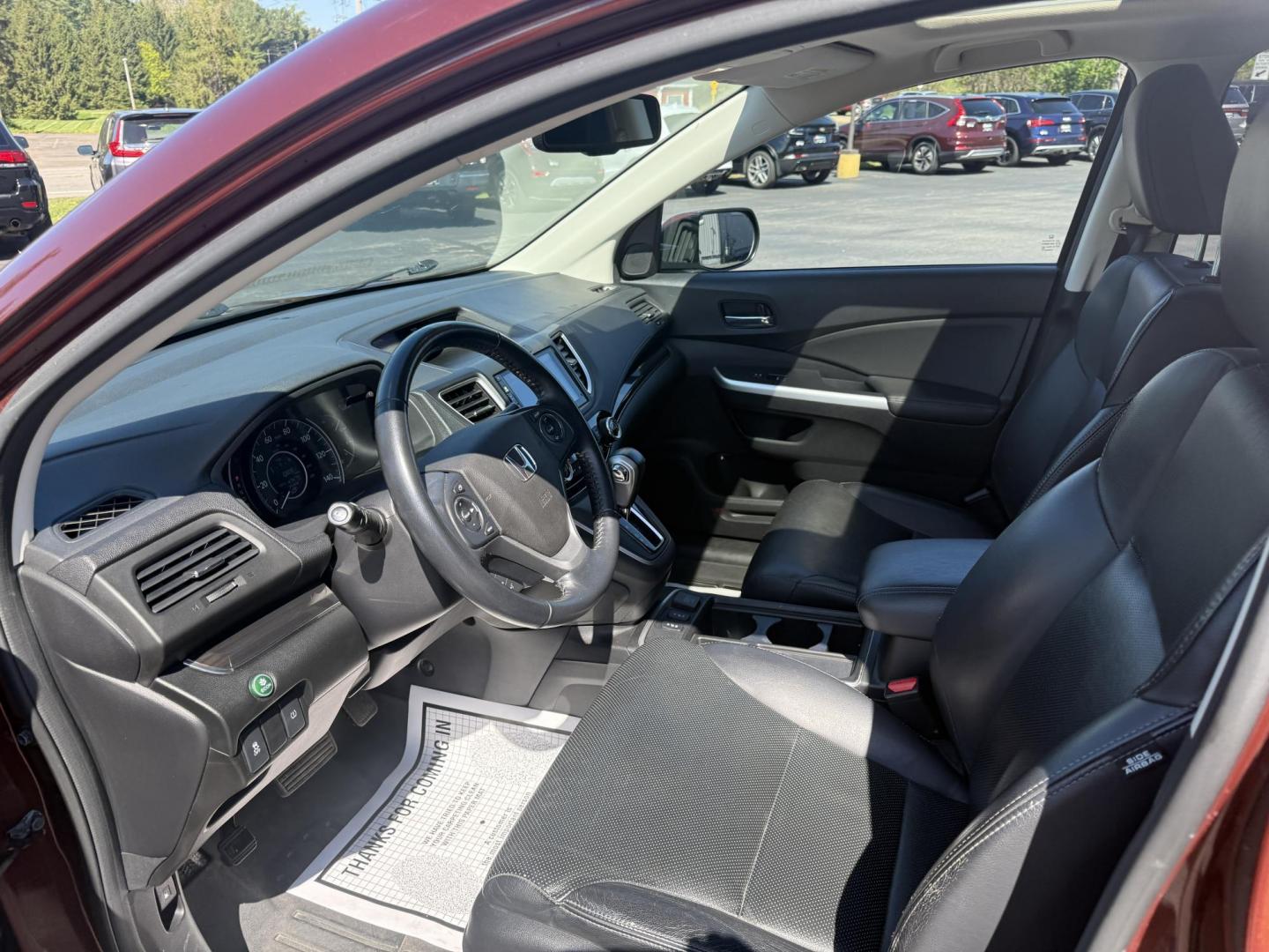 2015 Red /Black Honda CR-V EX-L 4WD (2HKRM4H73FH) with an 2.4L I4 DOHC 16V engine, Automatic transmission, located at 11115 Chardon Rd. , Chardon, OH, 44024, (440) 214-9705, 41.580246, -81.241943 - This One Owner 2015 Honda CR-V EX-L AWD has luxury, reliability and, fuel efficiency. Powered by Honda's incredible 2.4 I4 Engine and CVT (Continuously Variable Transmission) it achieves up to 32 MPG Highway while still have all weather capability due to it's all wheel drive system. With a leather i - Photo#15
