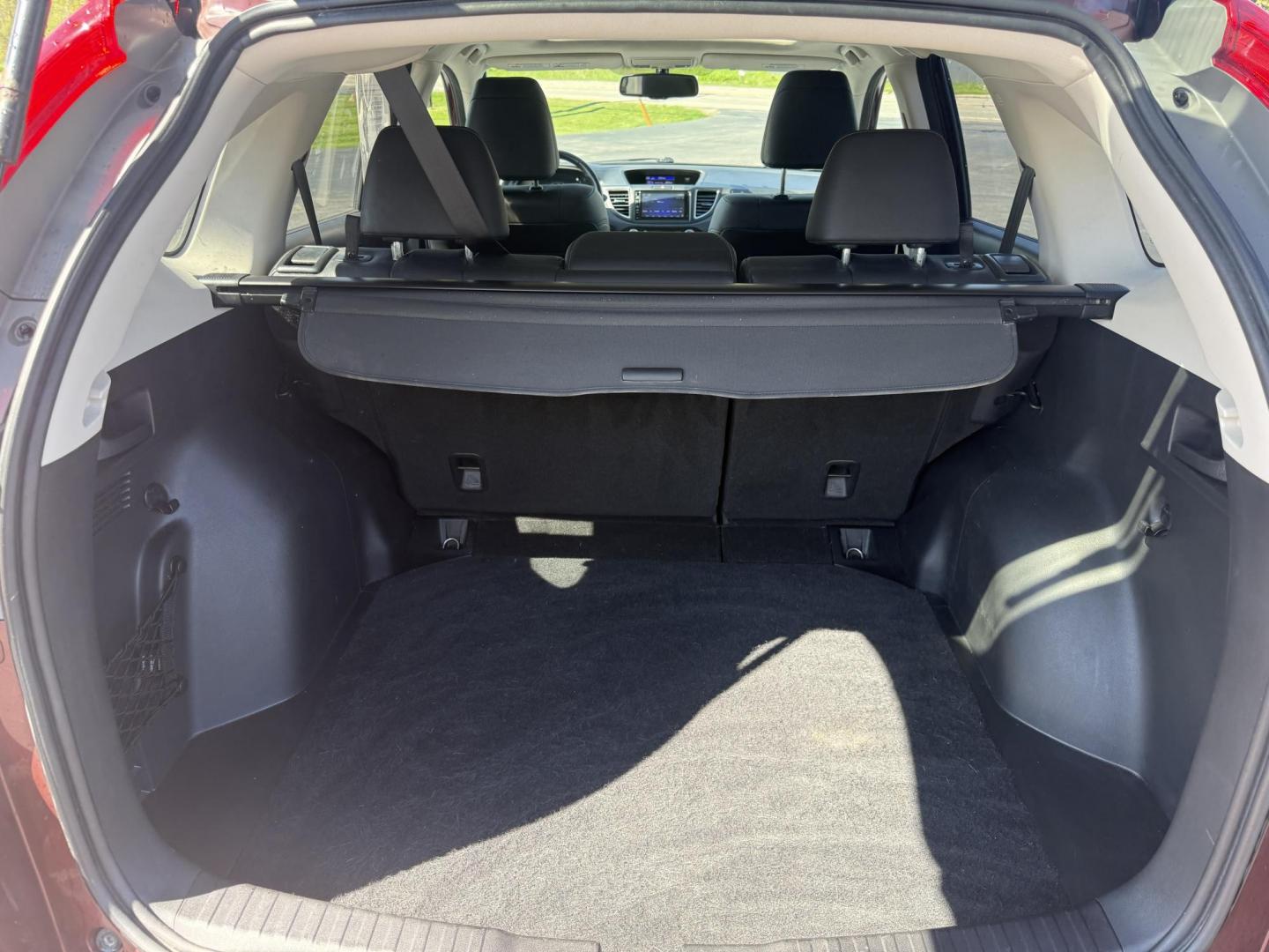 2015 Red /Black Honda CR-V EX-L 4WD (2HKRM4H73FH) with an 2.4L I4 DOHC 16V engine, Automatic transmission, located at 11115 Chardon Rd. , Chardon, OH, 44024, (440) 214-9705, 41.580246, -81.241943 - This One Owner 2015 Honda CR-V EX-L AWD has luxury, reliability and, fuel efficiency. Powered by Honda's incredible 2.4 I4 Engine and CVT (Continuously Variable Transmission) it achieves up to 32 MPG Highway while still have all weather capability due to it's all wheel drive system. With a leather i - Photo#39