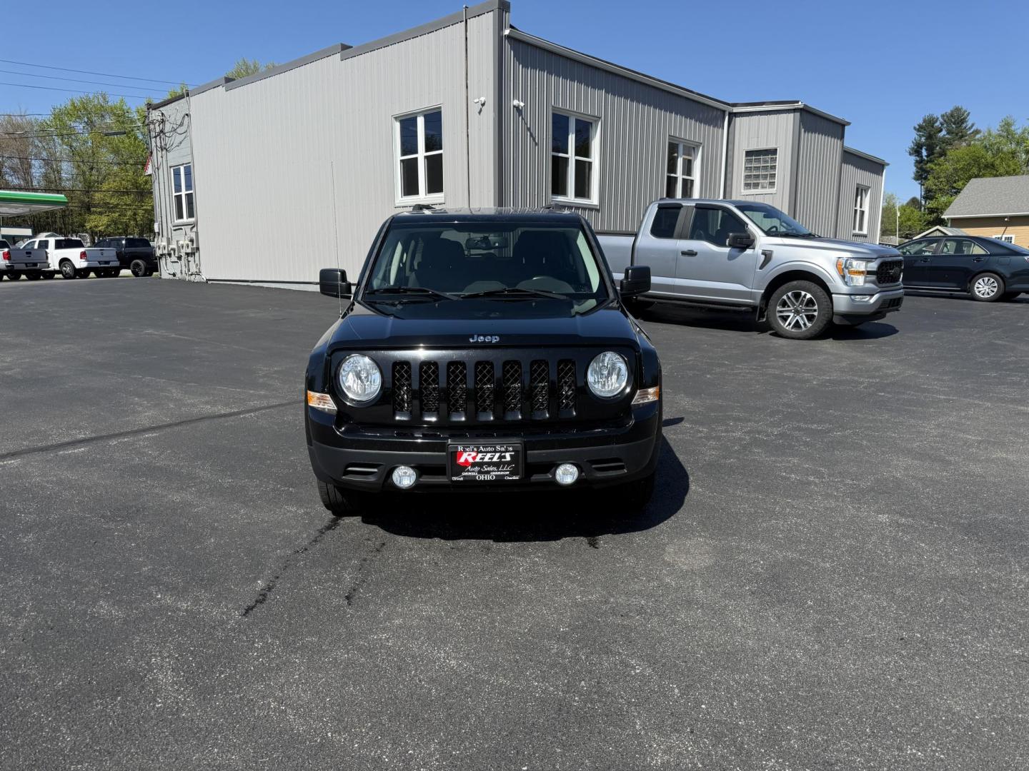 2014 Black /Black Jeep Patriot Latitude 4WD (1C4NJRFB8ED) with an 2.4L I4 DOHC 16V engine, 6 Speed Automatic transmission, located at 11115 Chardon Rd. , Chardon, OH, 44024, (440) 214-9705, 41.580246, -81.241943 - This One Owner 2014 Jeep Patriot Latitude 4WD is the perfect small SUV. Powered by a 2.4 I4 Multiair Engine and a 6 Speed Automatic this Jeep achieves up to 27 MPG Highway while still having Jeep's incredible all weather capability. With heated front seats, remote start and, an auto dimming rearview - Photo#1