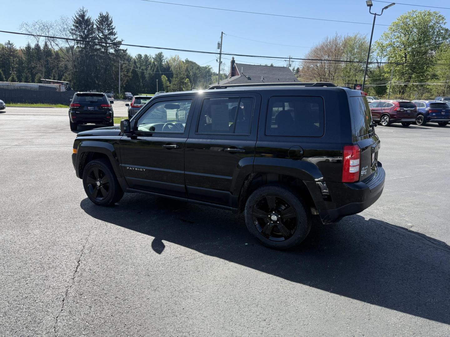 2014 Black /Black Jeep Patriot Latitude 4WD (1C4NJRFB8ED) with an 2.4L I4 DOHC 16V engine, 6 Speed Automatic transmission, located at 11115 Chardon Rd. , Chardon, OH, 44024, (440) 214-9705, 41.580246, -81.241943 - This One Owner 2014 Jeep Patriot Latitude 4WD is the perfect small SUV. Powered by a 2.4 I4 Multiair Engine and a 6 Speed Automatic this Jeep achieves up to 27 MPG Highway while still having Jeep's incredible all weather capability. With heated front seats, remote start and, an auto dimming rearview - Photo#10