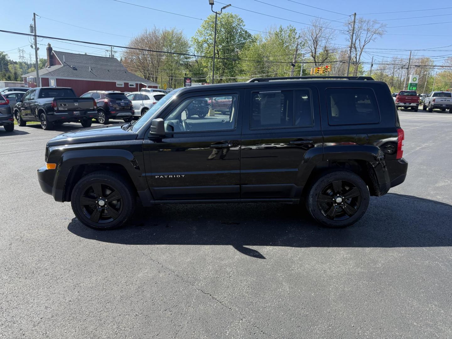 2014 Black /Black Jeep Patriot Latitude 4WD (1C4NJRFB8ED) with an 2.4L I4 DOHC 16V engine, 6 Speed Automatic transmission, located at 11115 Chardon Rd. , Chardon, OH, 44024, (440) 214-9705, 41.580246, -81.241943 - This One Owner 2014 Jeep Patriot Latitude 4WD is the perfect small SUV. Powered by a 2.4 I4 Multiair Engine and a 6 Speed Automatic this Jeep achieves up to 27 MPG Highway while still having Jeep's incredible all weather capability. With heated front seats, remote start and, an auto dimming rearview - Photo#12